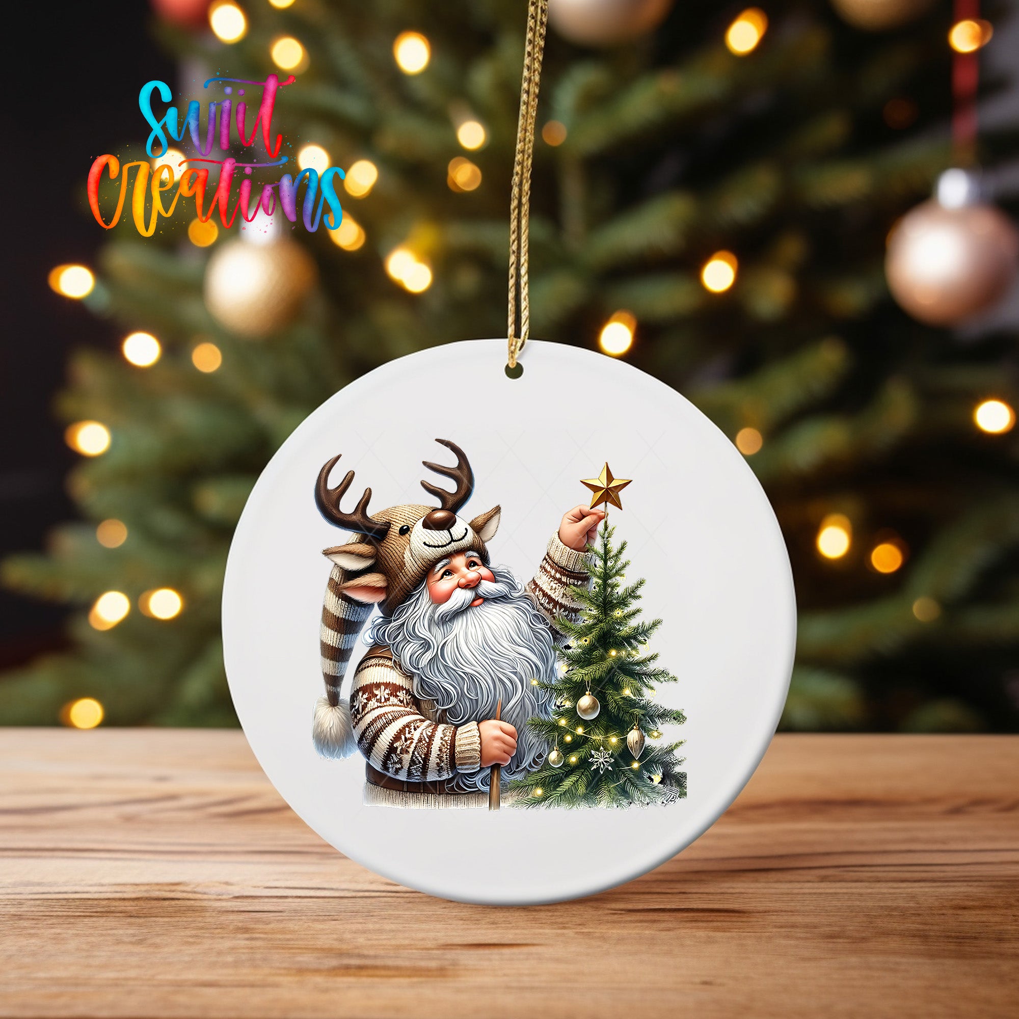 A white ornament featuring a Santa Claus figure with antlers and a star on a Christmas tree, with a blurred background of lights and a tree.