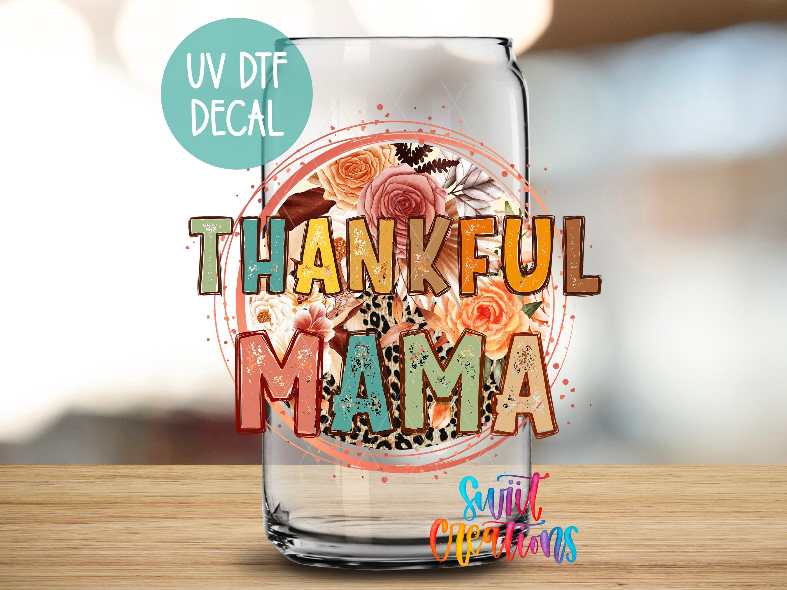 a glass jar with a floral design and the text "THANKFUL MAMA" printed on it.