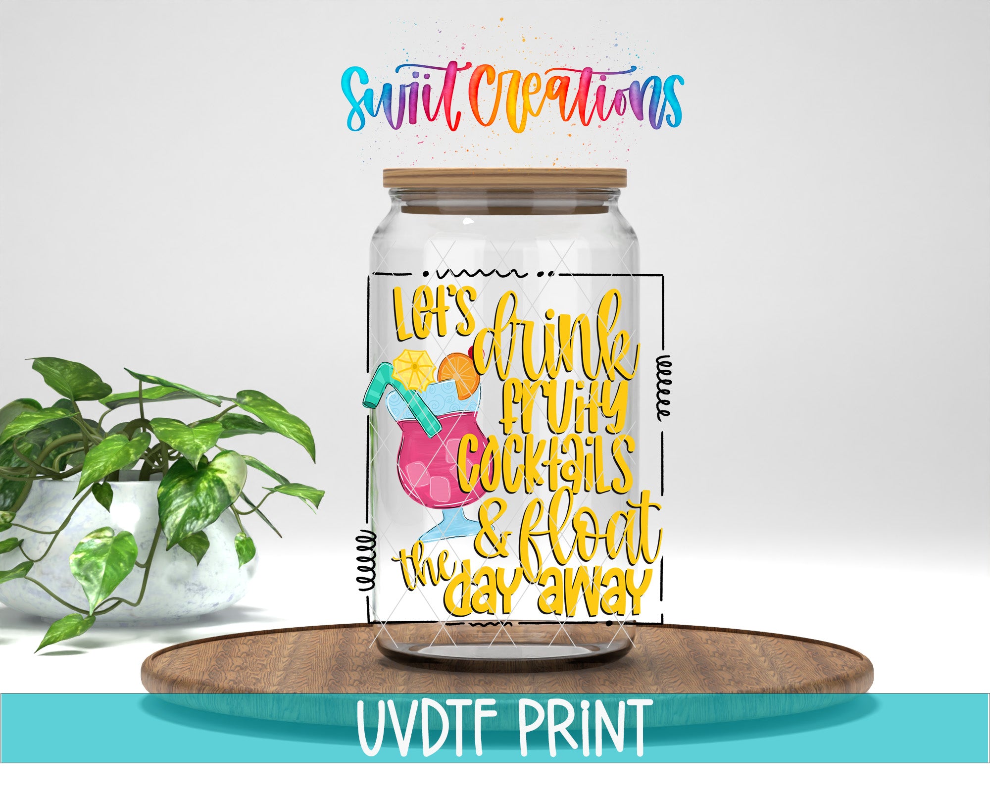 A glass jar with a colorful design and text, placed on a wooden tray, with a potted plant in the background.