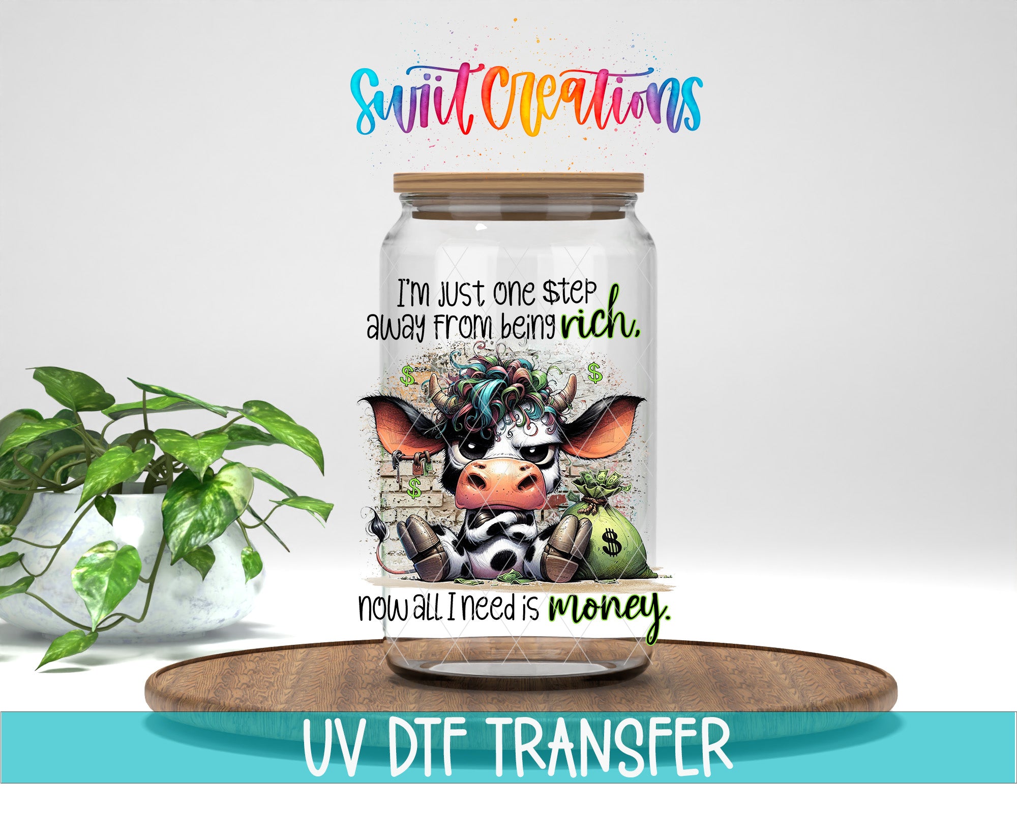 A jar with a cow design on it, accompanied by text that reads "I'm just one step away from being rich now all I need is money." The jar is placed on a wooden tray, and there is a potted plant in the background.