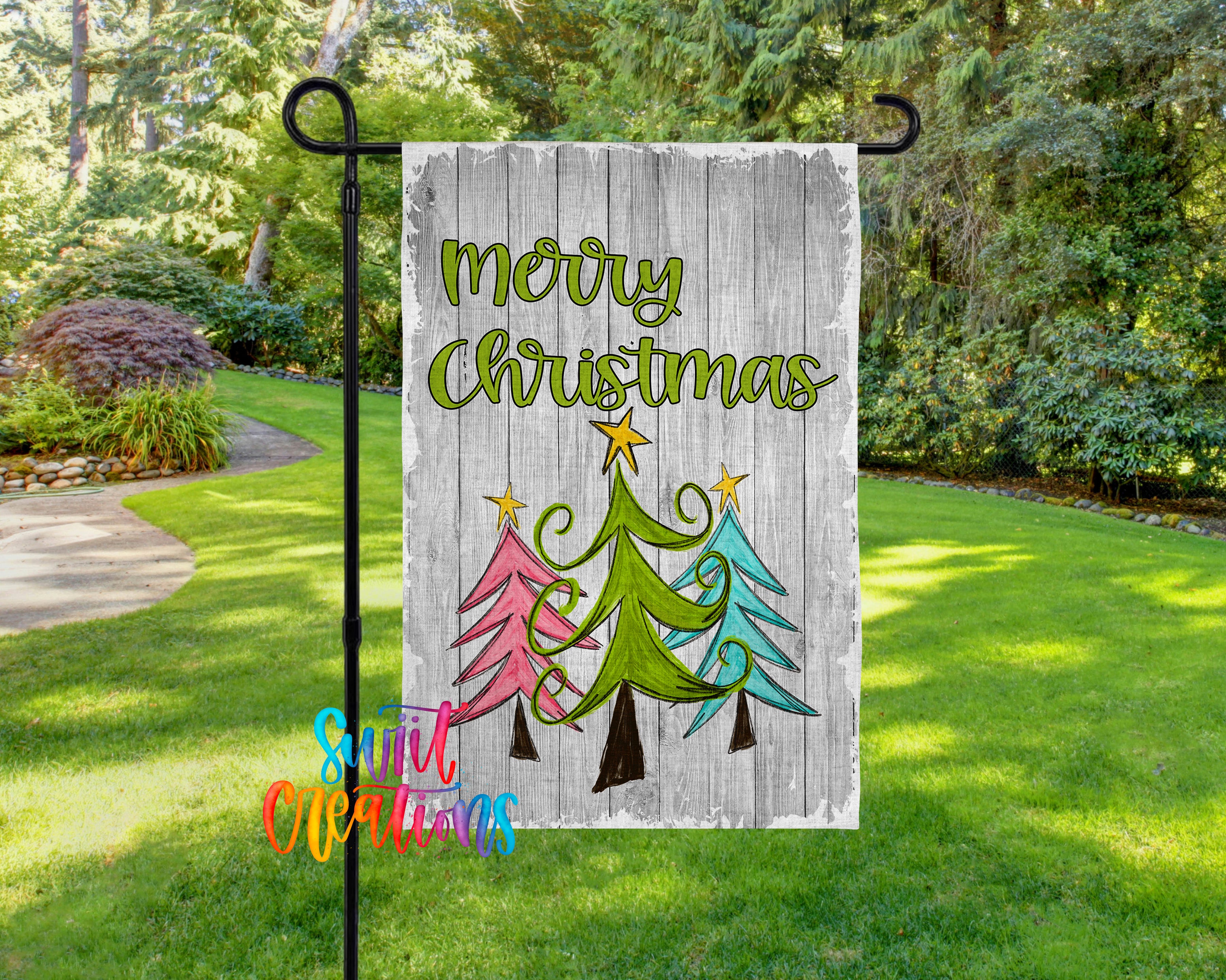 A garden flag with a festive Christmas design, featuring a tree with three colored lights and the text "Merry Christmas" displayed on it.