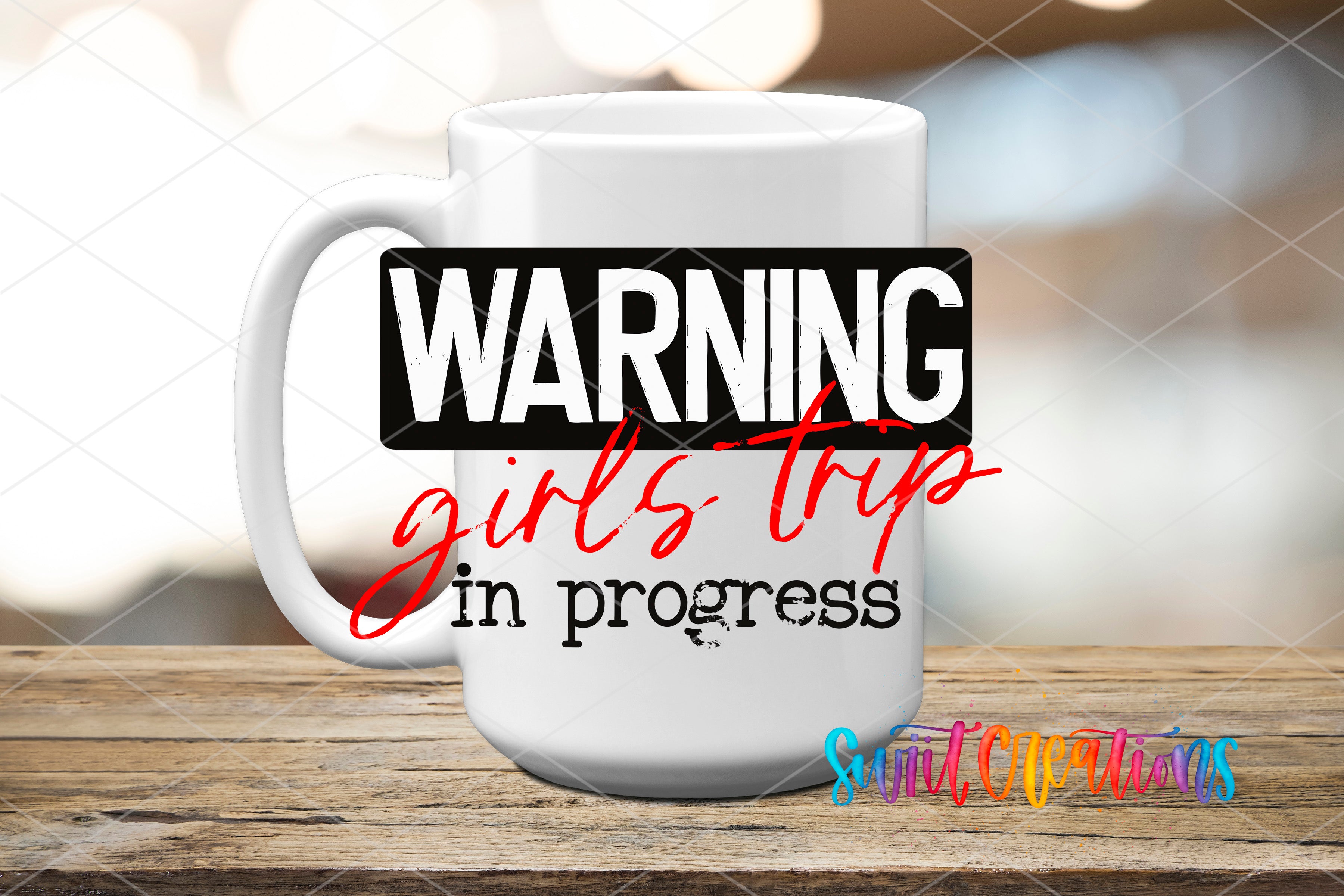 A white mug with the text "WARNING girls trip in progress" printed on it, along with a graphic of a person's face.