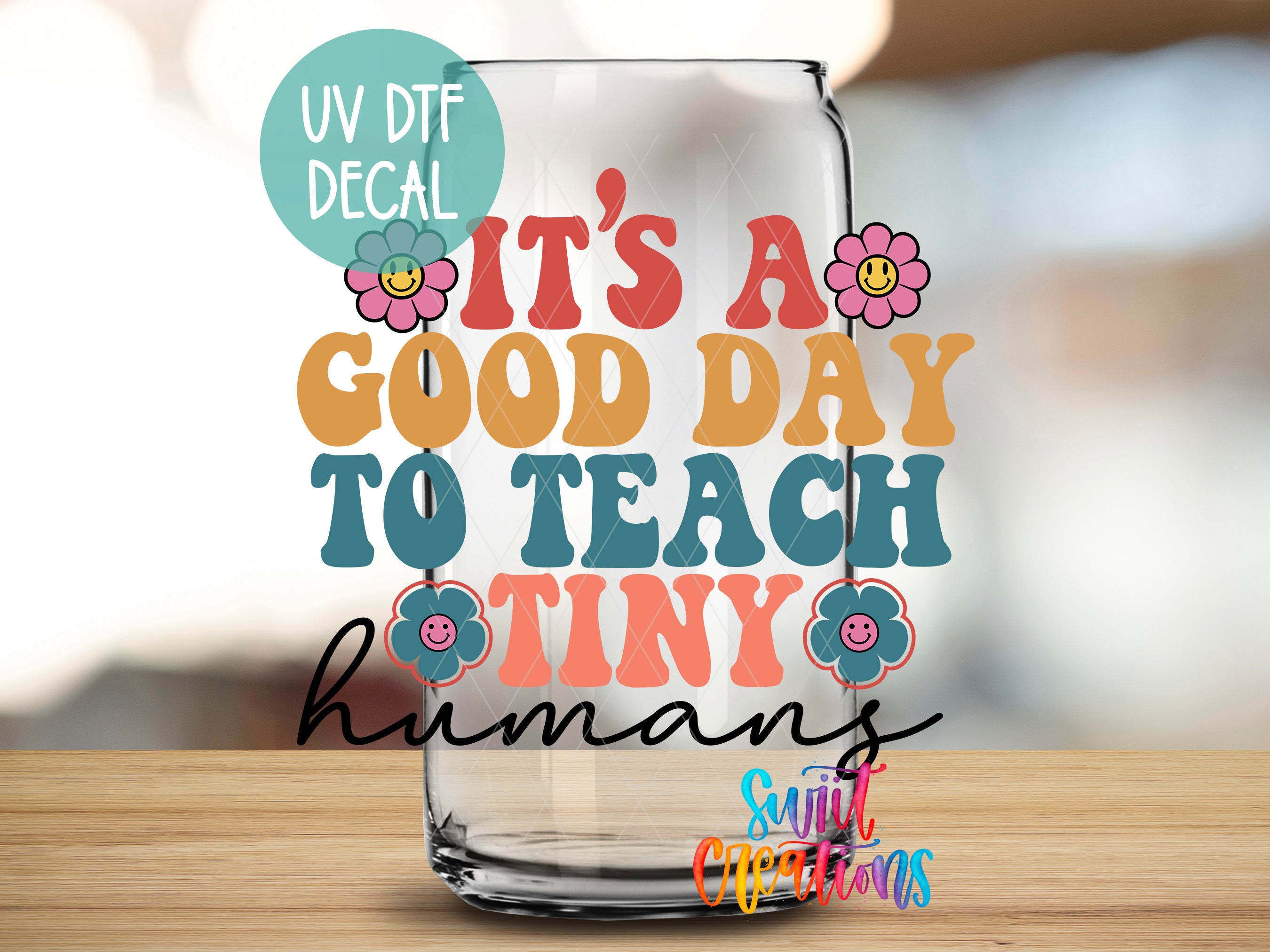 a glass with a saying that says it's a good day to teach tiny