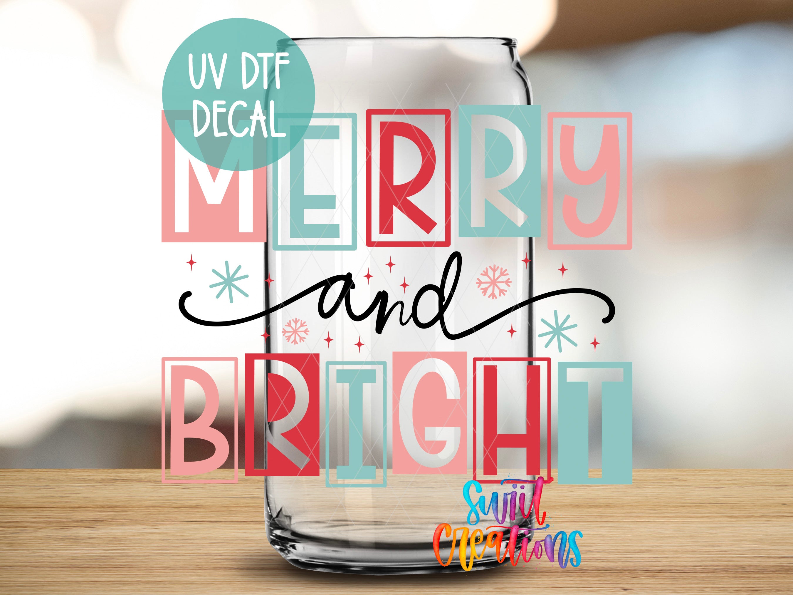 a glass with merry and bright lettering on it