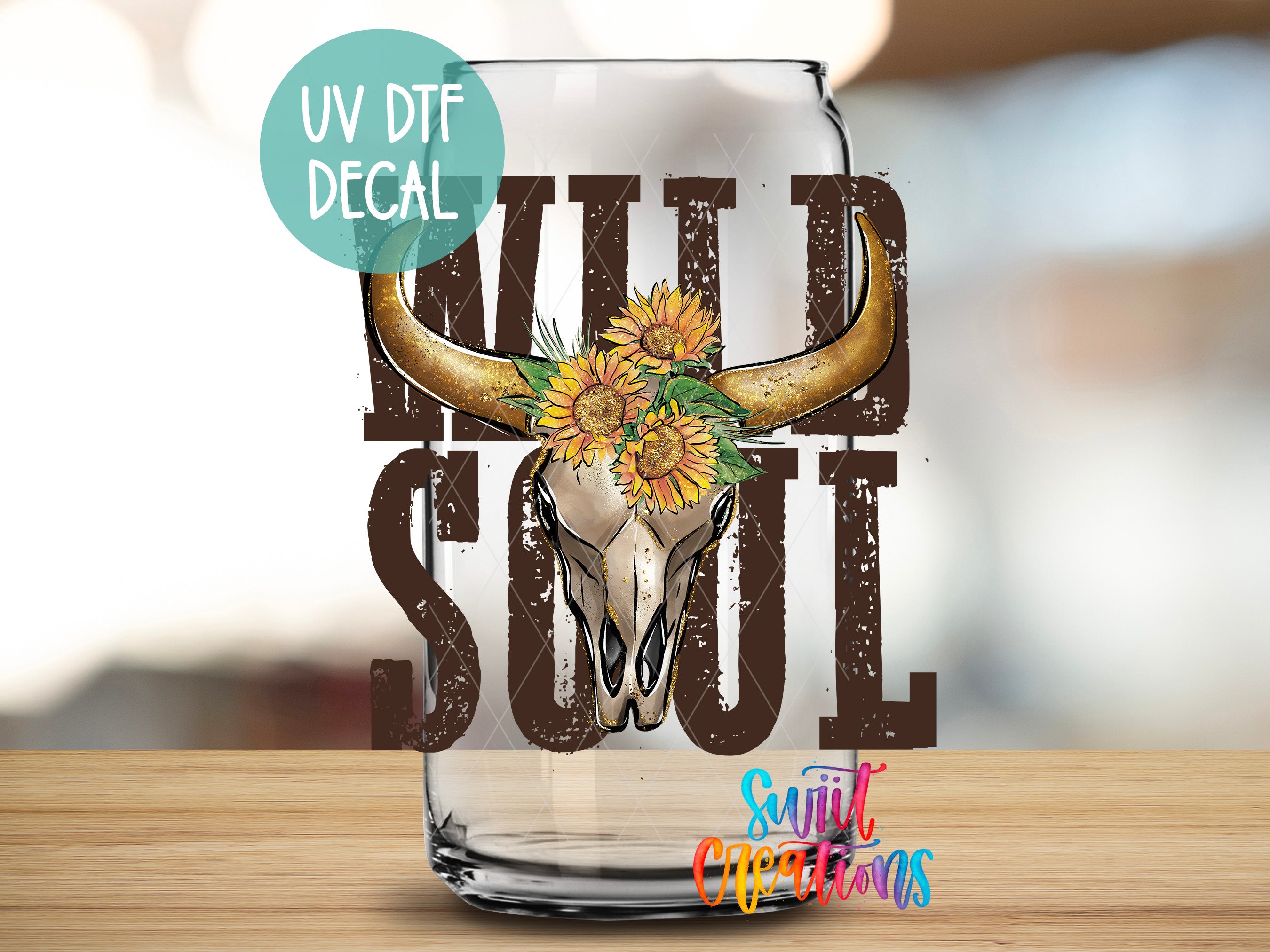 a glass with a bull skull and sunflowers on it