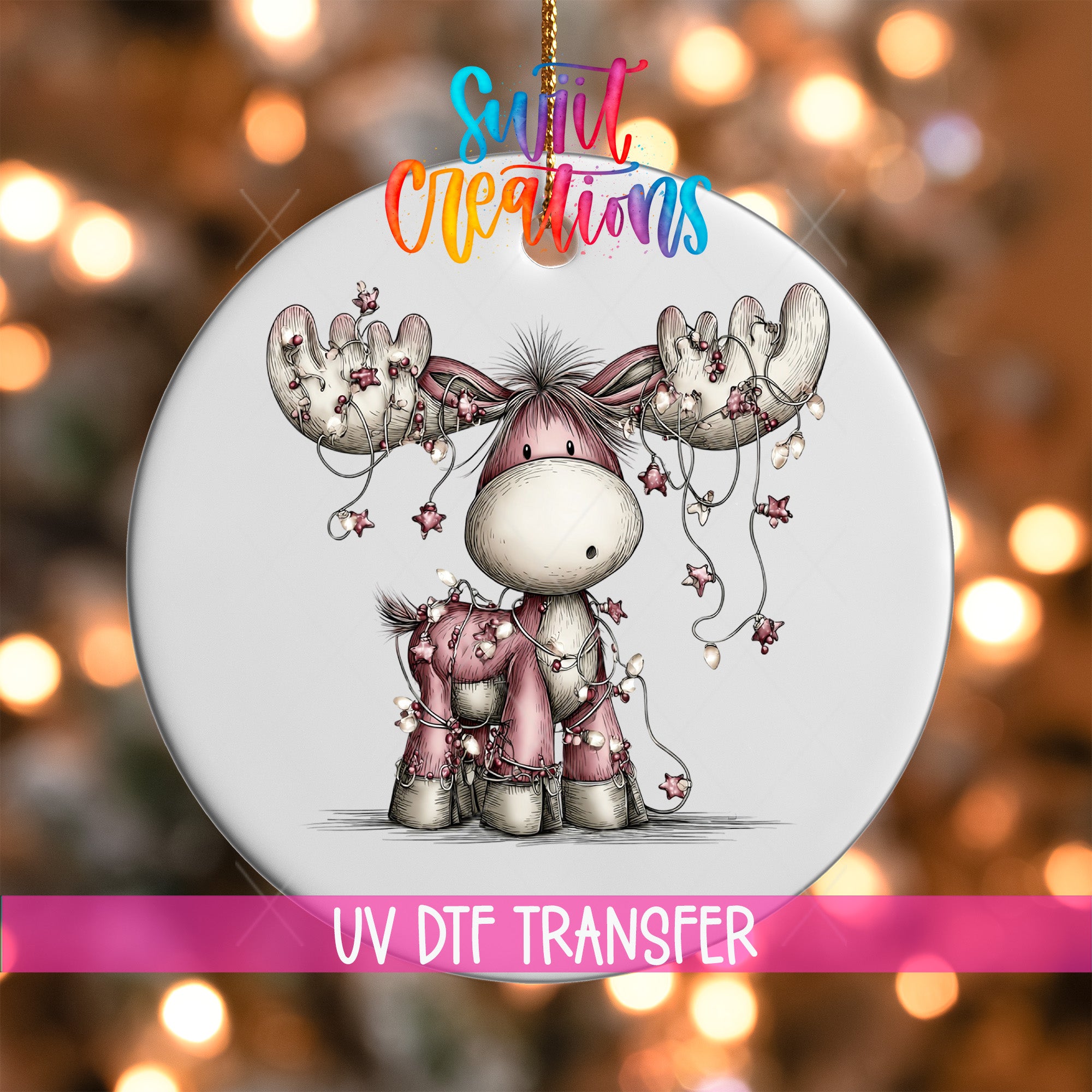 A decorative ornament featuring a cartoon moose with a pink hat and antlers, surrounded by Christmas lights.