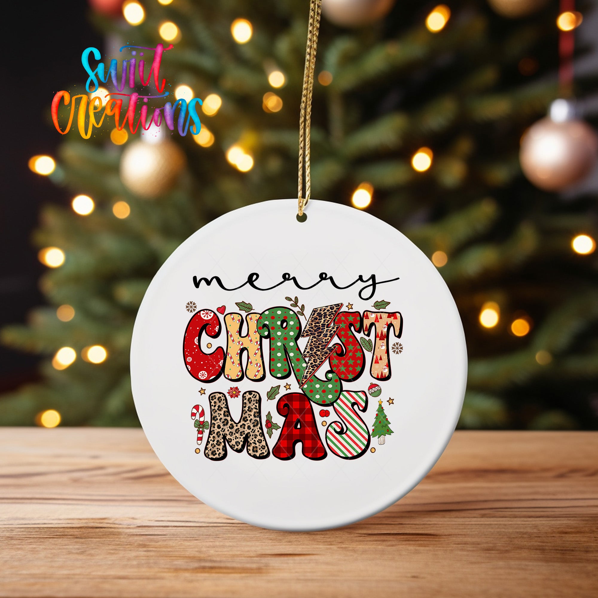 A white Christmas ornament with the text "MERRY CHRISTMAS" printed on it, hanging from a string.