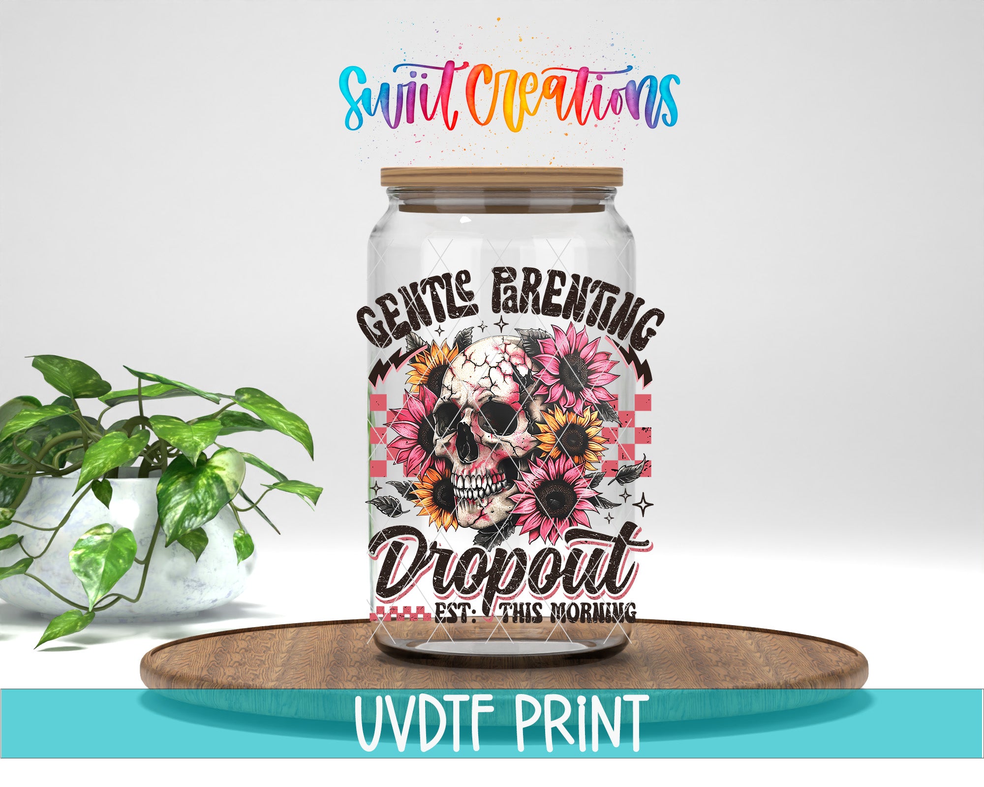 a glass jar with a label that reads "GENTLE PARENTING DROPOUT EST. THIS MORNING" and has a skull and sunflower design. The jar is placed on a wooden tray, and there is a potted plant in the background.