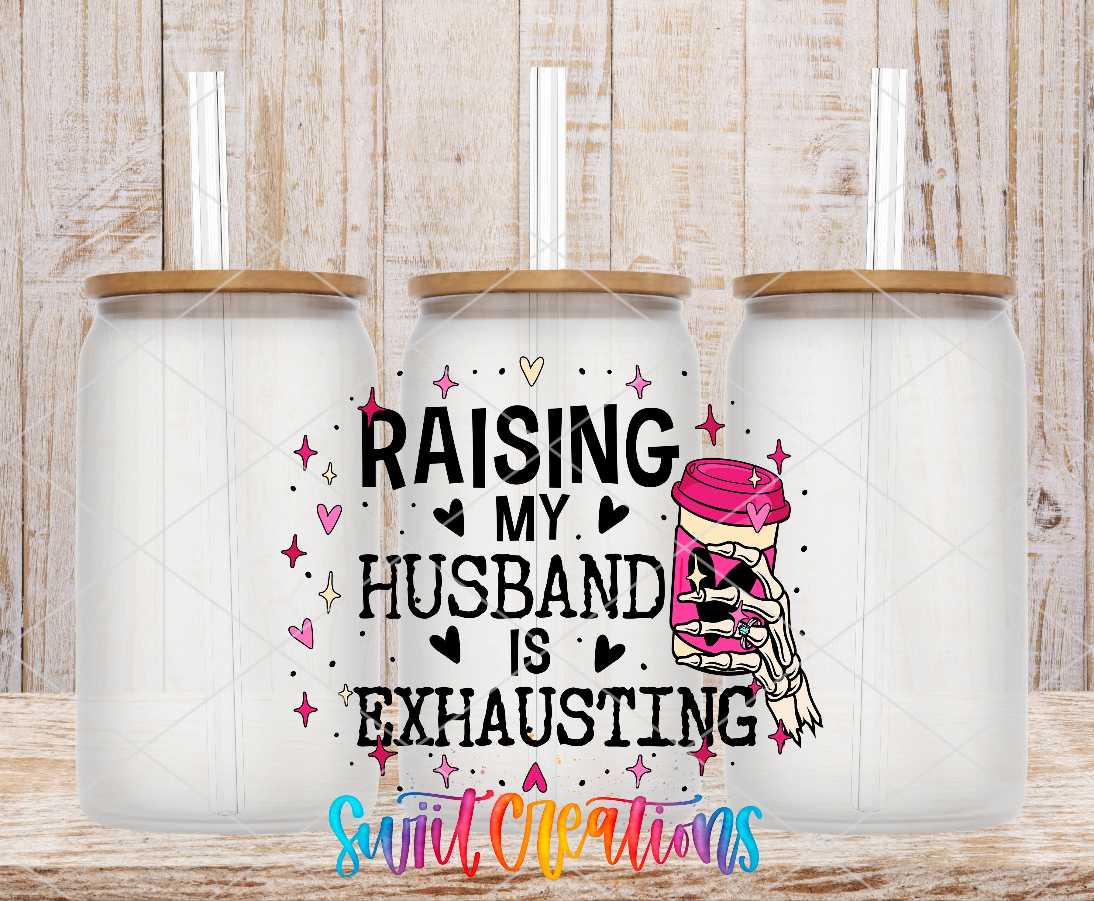 Swiit Creations UV DTF Raising My Husband Is Exhausting transfer shown on a clear glass can set