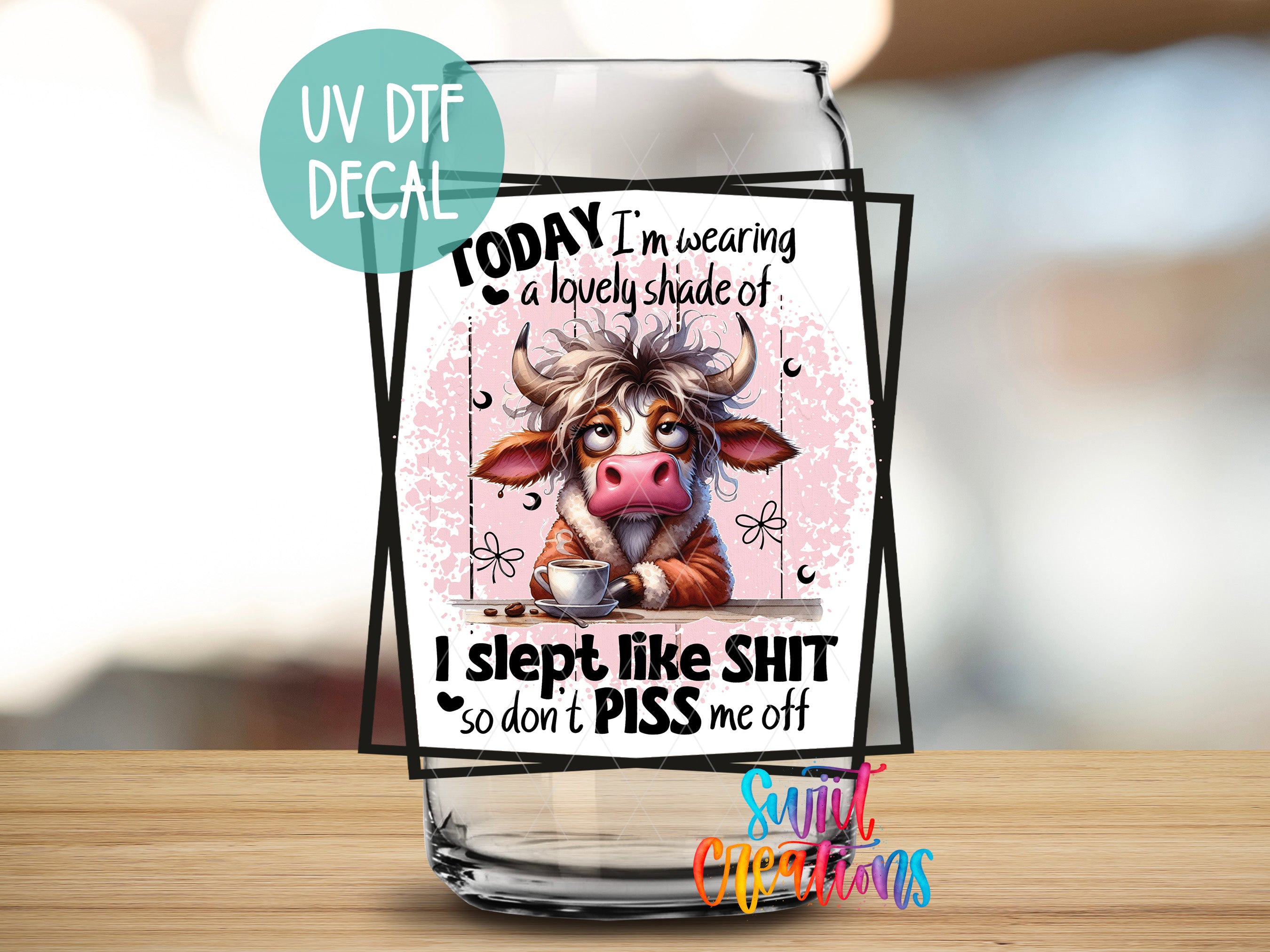 a glass with a picture of a cow on it