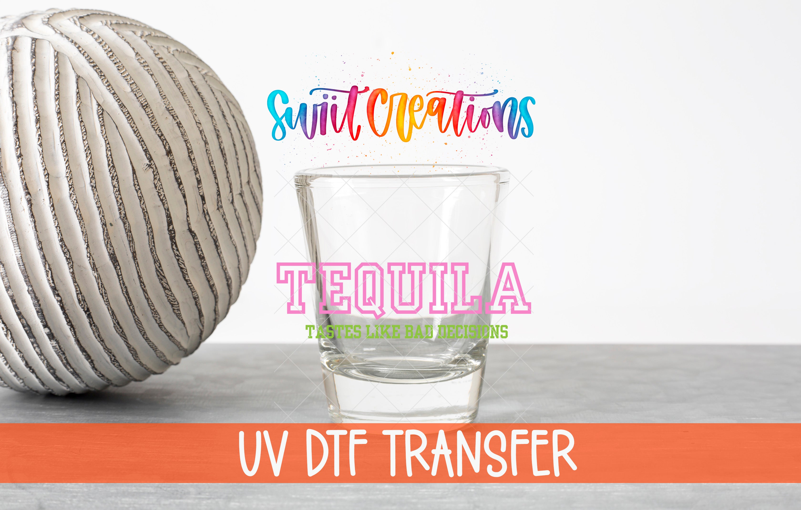 a glass of clear liquid, possibly tequila, with a striped ball next to it. The text above the glass reads "Swit Creations" and "UV Dtf Transfer", suggesting that the image is related to a creative project or design.