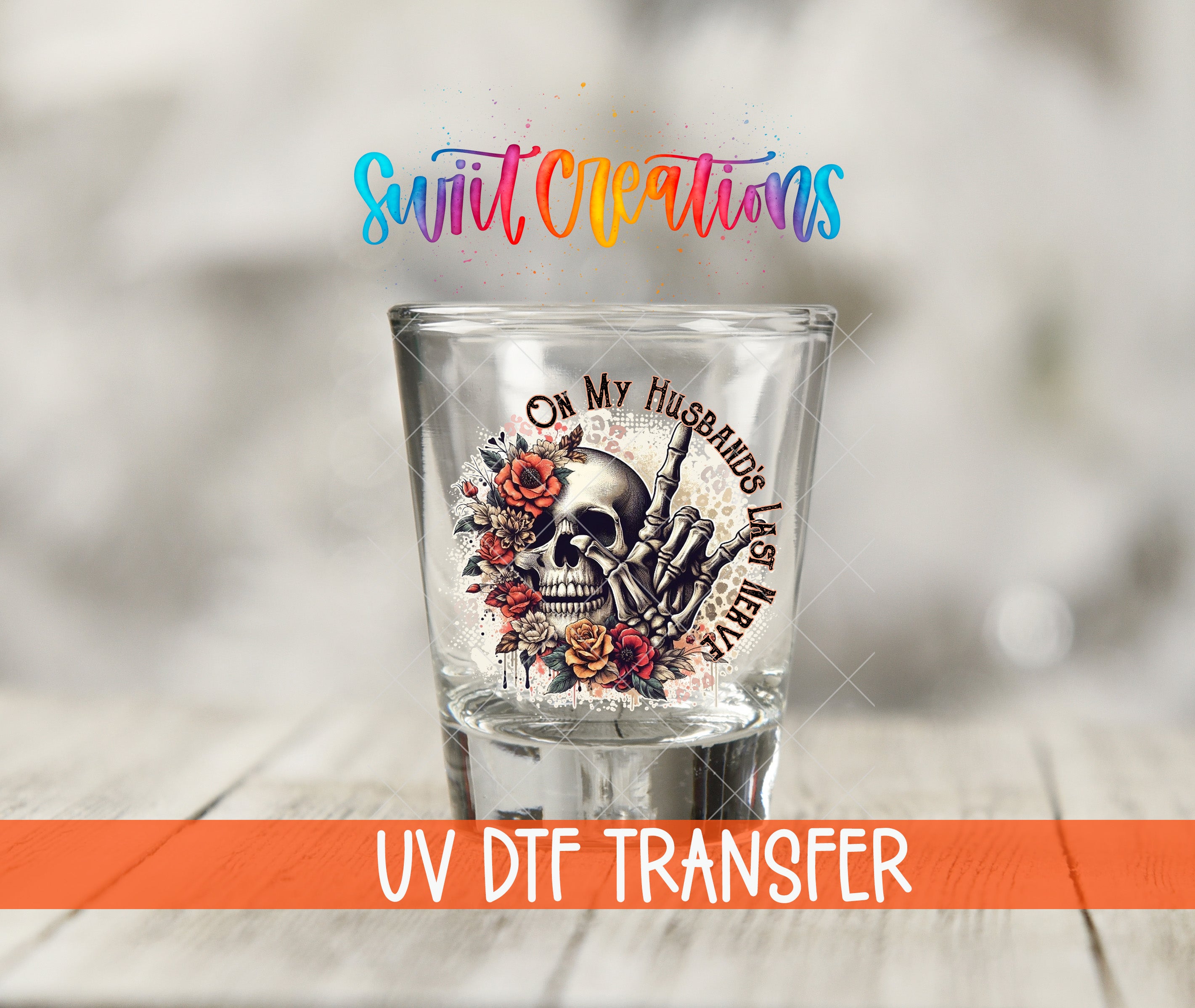 A shot glass with a skull design and floral elements, along with the text "UV Dtf Transfer" and "Swift Creations" written above it.