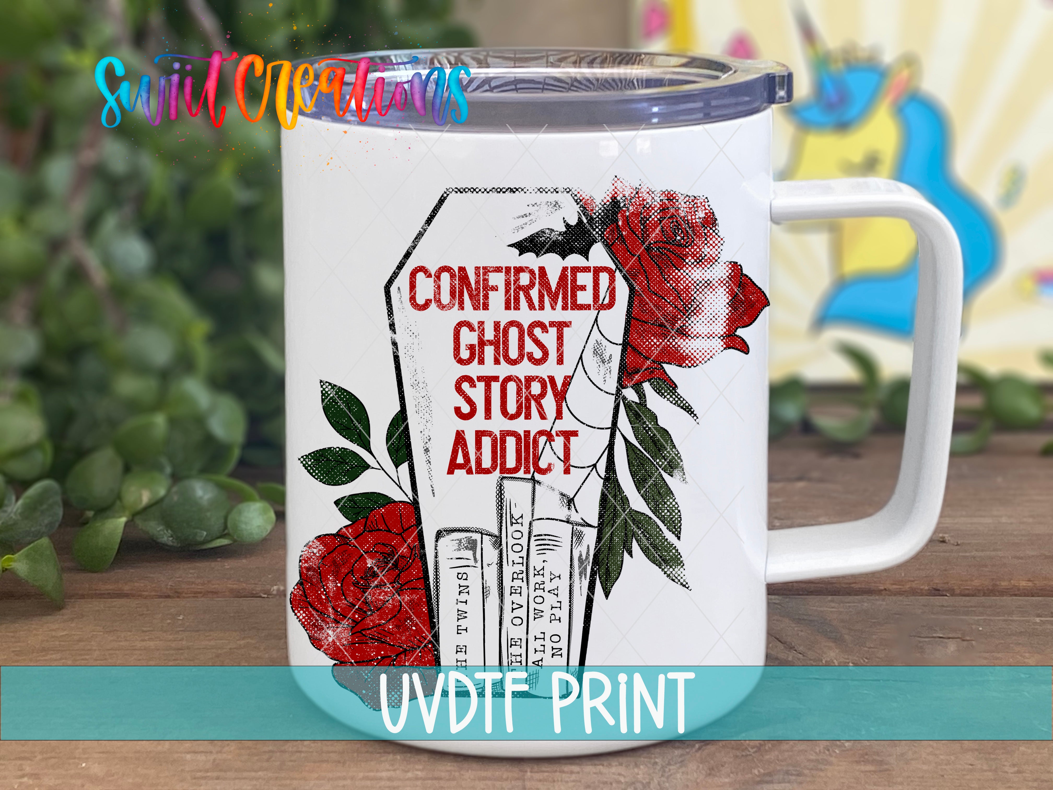 a white coffee mug with red roses on it