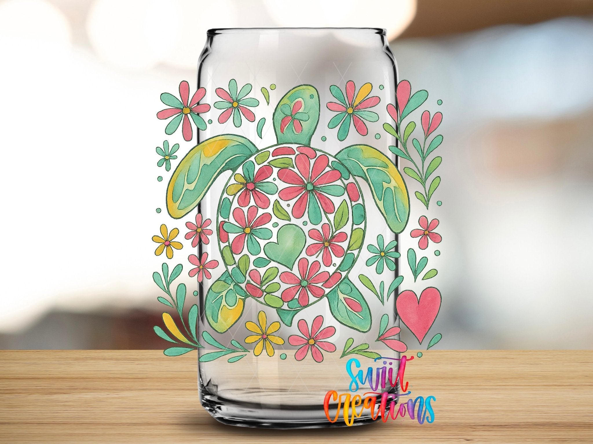 Floral Sea Turtle UV DTF transfer applied to a clear glass can from Swiit Creations