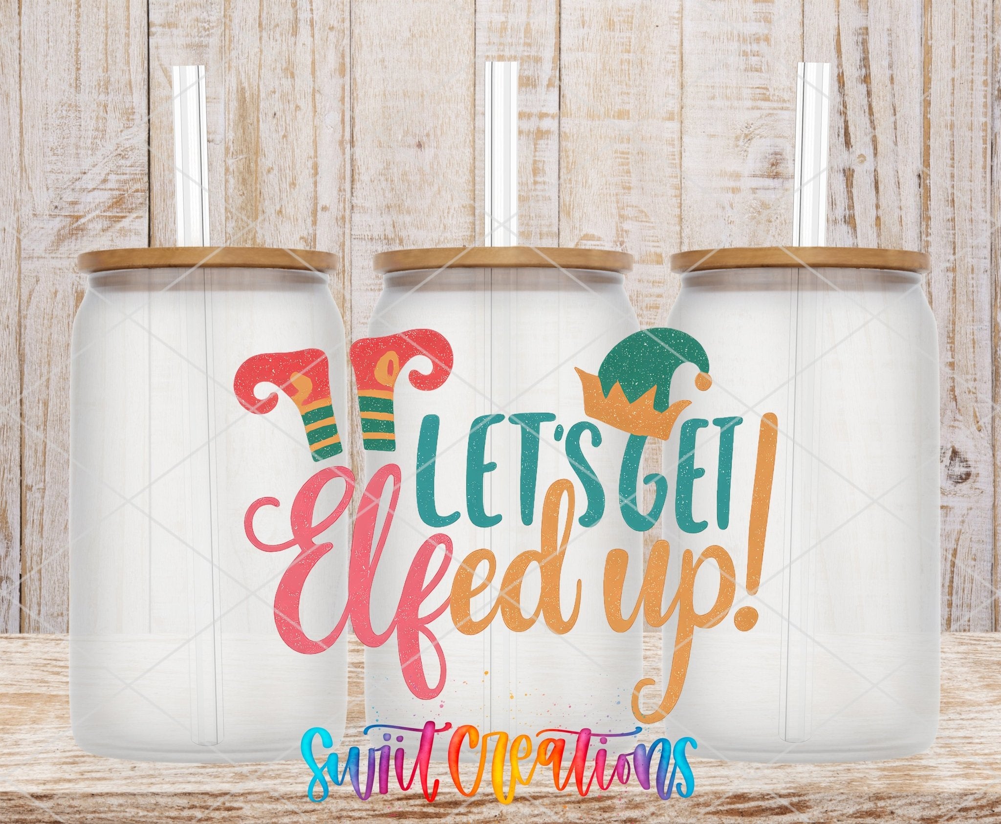 Let’s Get Elfed Up UV DTF transfer applied to a clear glass can set from Swiit Creations