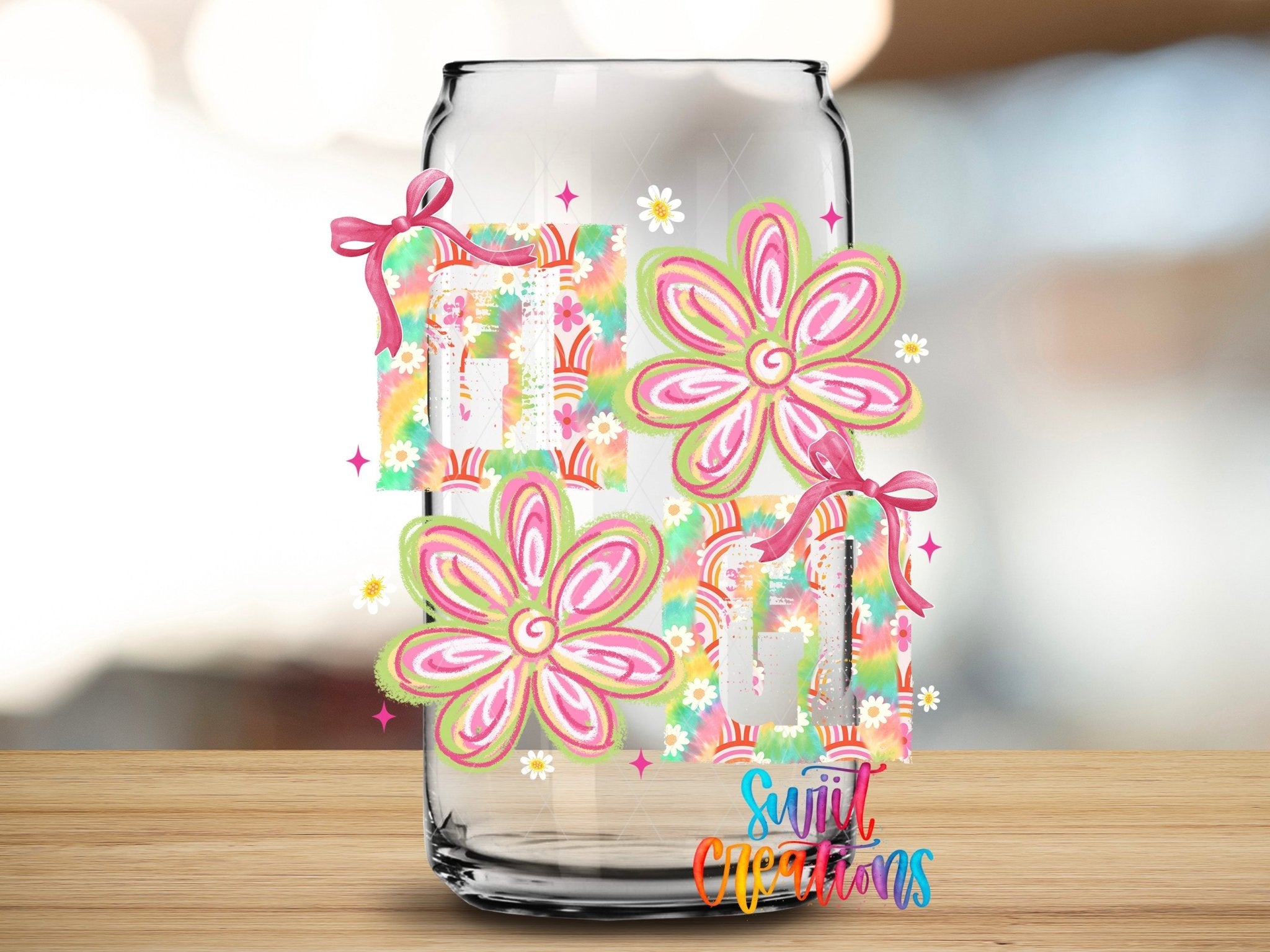 Gigi Tie Dye Flowers UV DTF transfer applied to a clear glass can from Swiit Creations