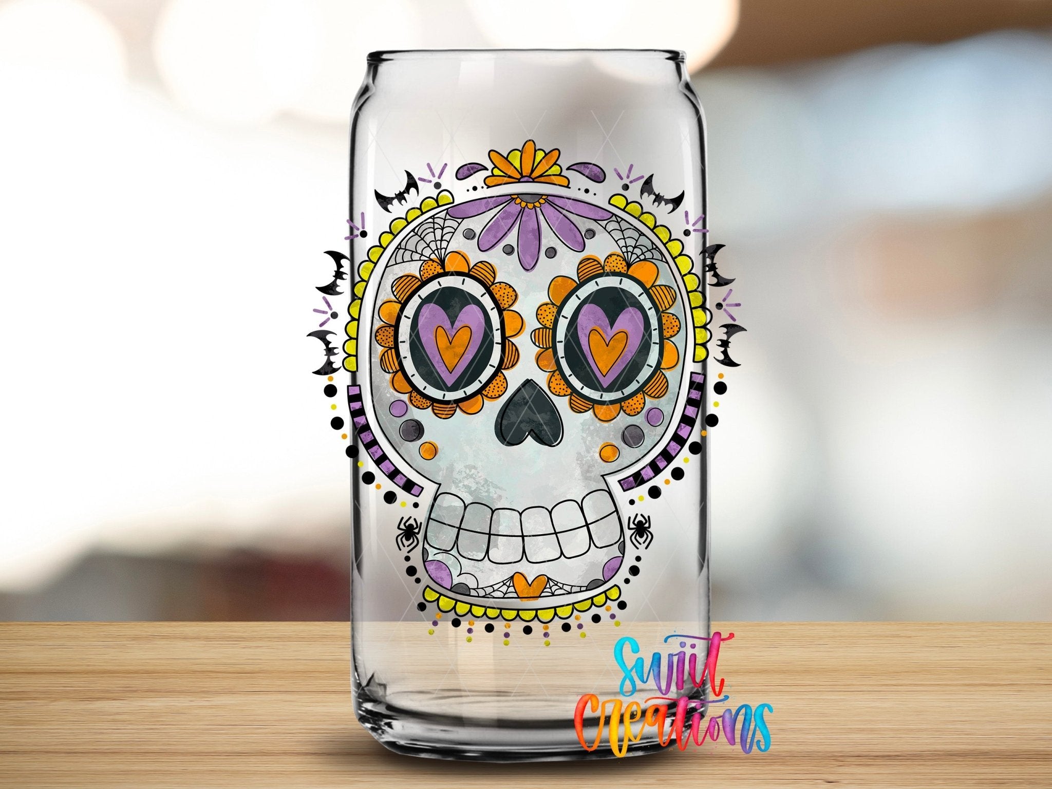 Halloween Sugar Skull Spooky Floral UV DTF transfer applied to a clear glass can from Swiit Creations