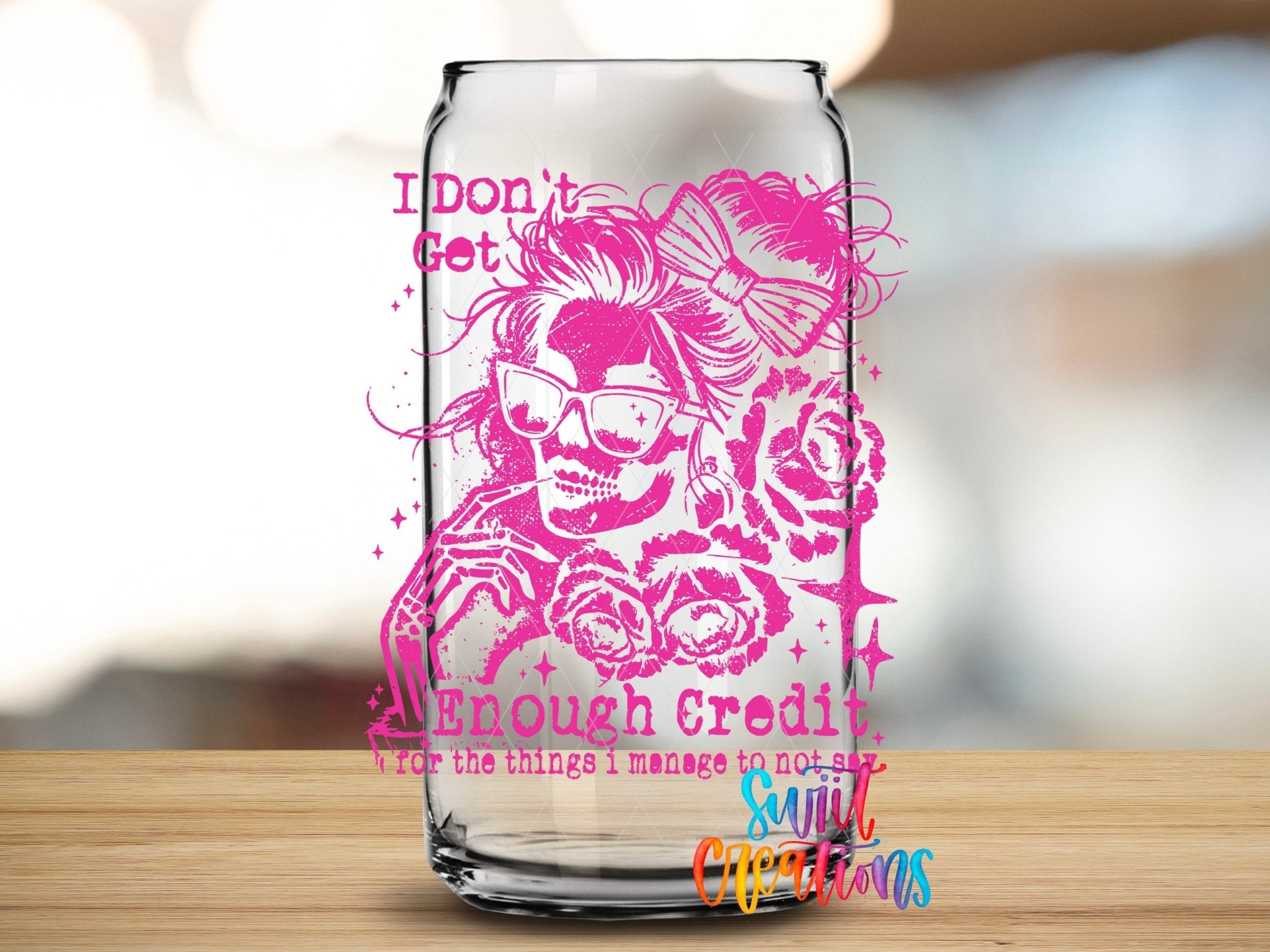I Don’t Get Enough Credit UV DTF transfer applied to a clear glass can from Swiit Creations