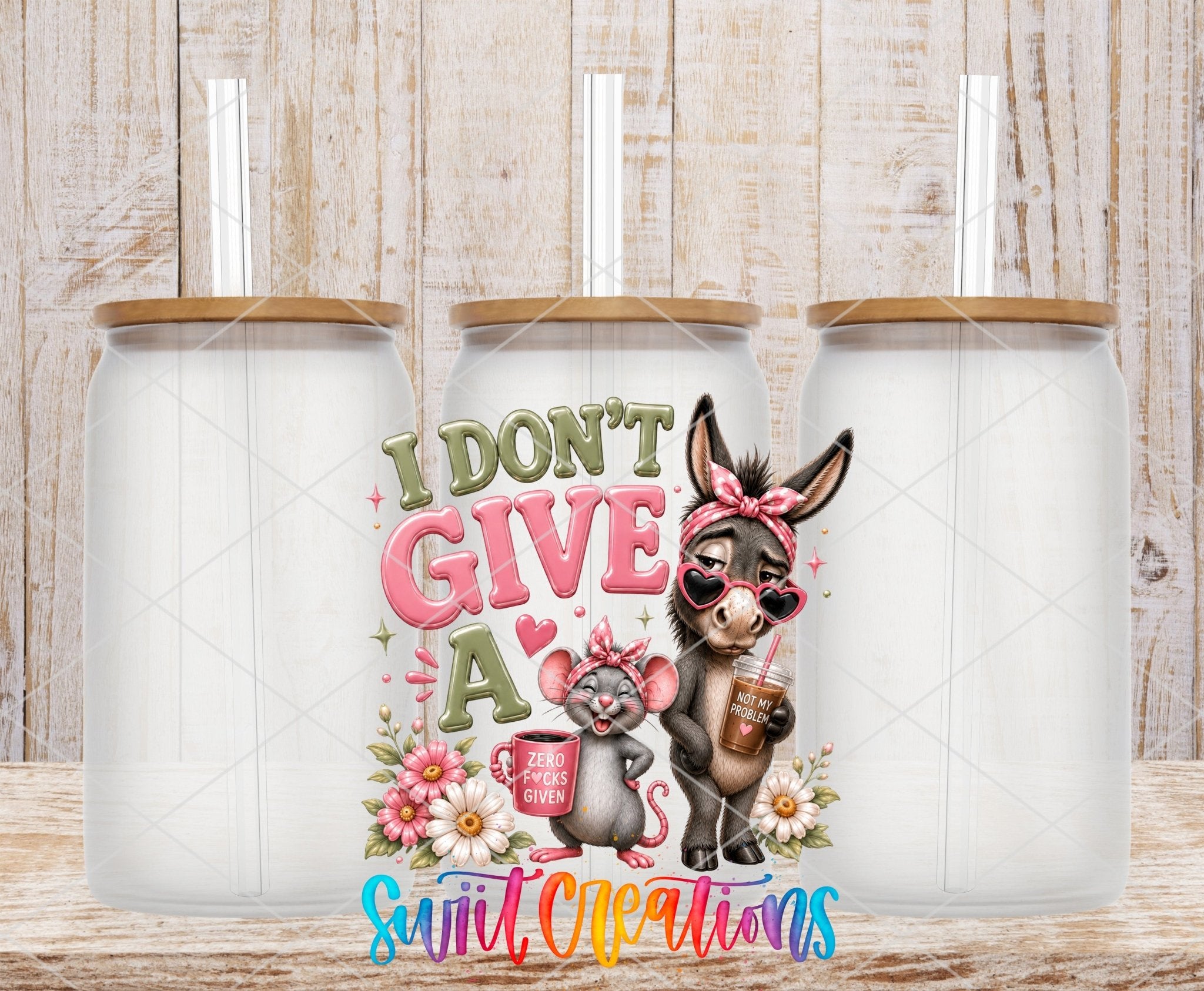 I Don't Give A Rat's Ass Donkey Mouse UV DTF transfer applied to a clear glass can set from Swiit Creations