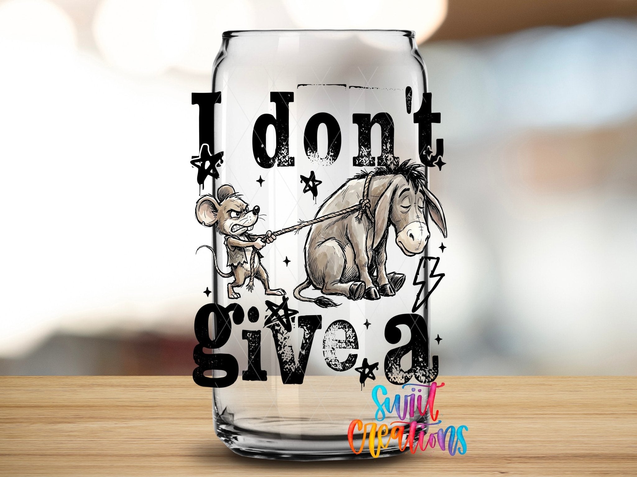 I Don’t Give A Rat’s Ass UV DTF transfer applied to a clear glass can from Swiit Creations