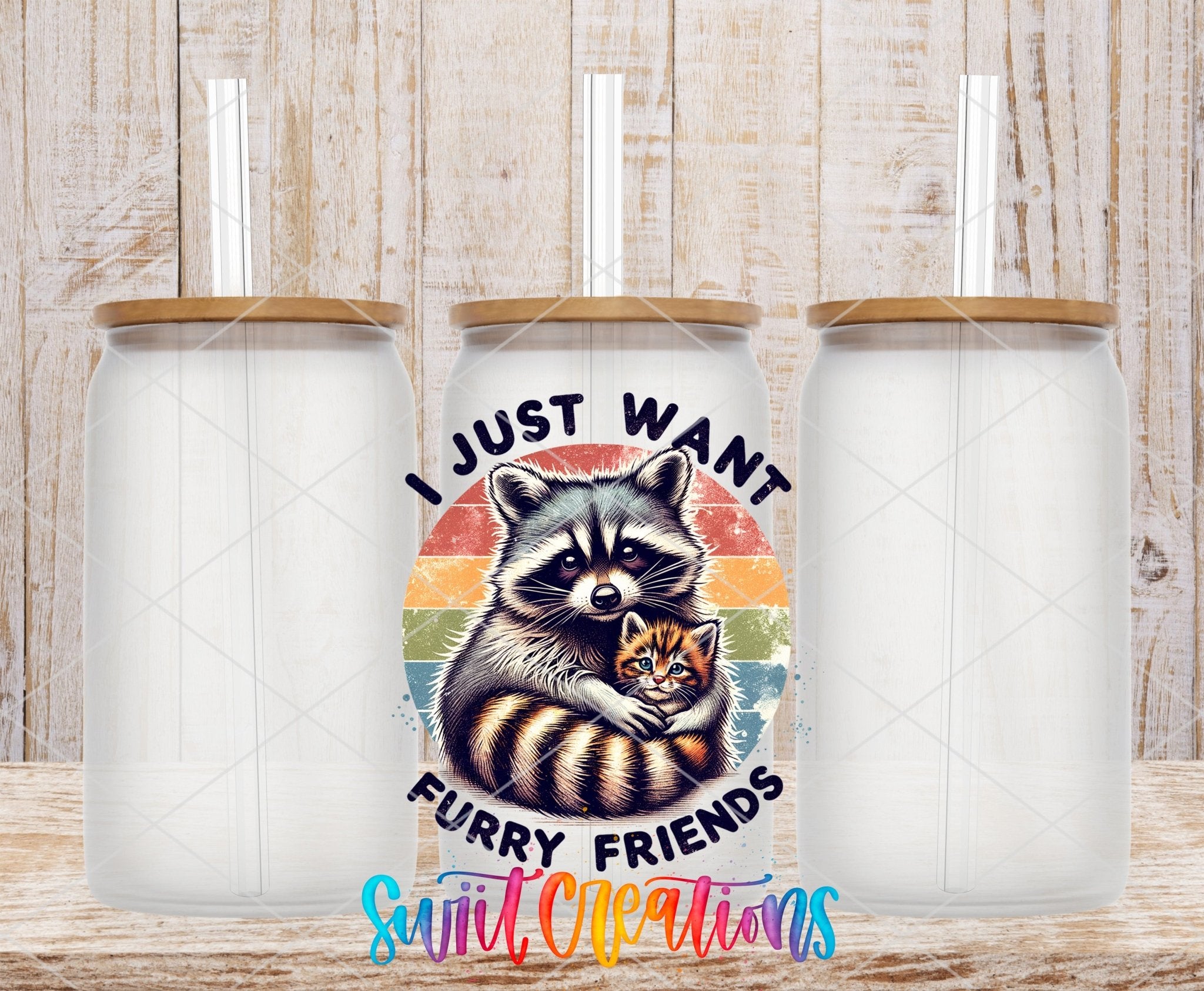 I Just Want Furry Friends UV DTF transfer applied to a clear glass can set from Swiit Creations
