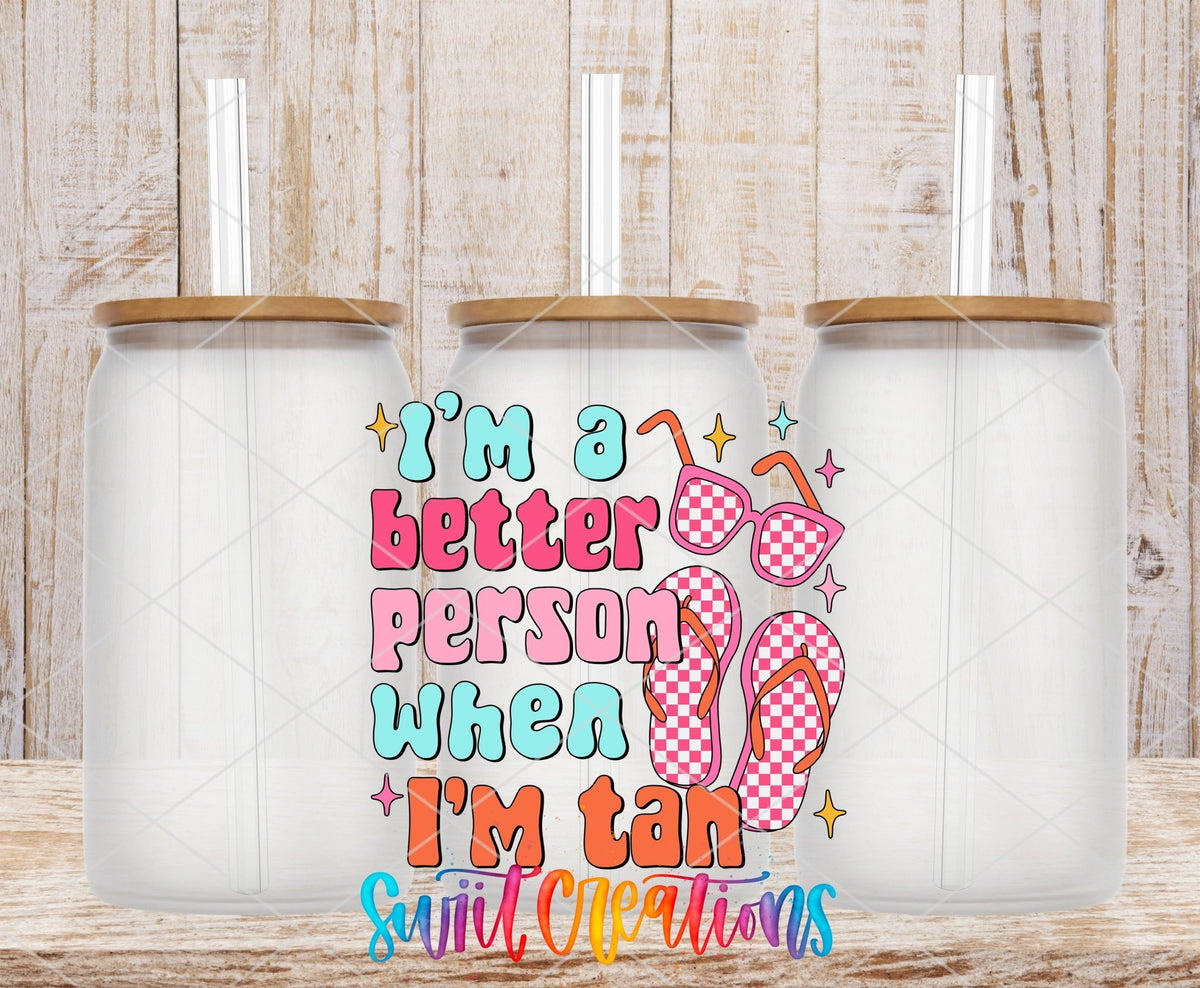 I’m a Better Person When I’m Tan UV DTF transfer applied to a clear glass can set from Swiit Creations