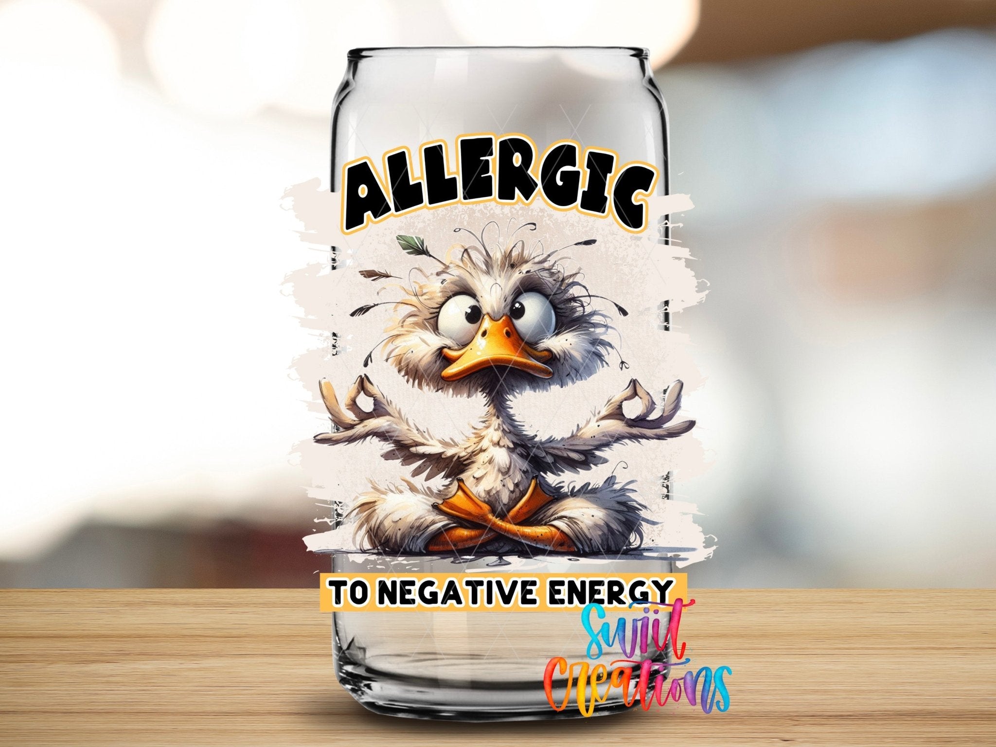 Swiit Creations UV DTF I'm Allergic To Negative Energy transfer applied to a clear glass can