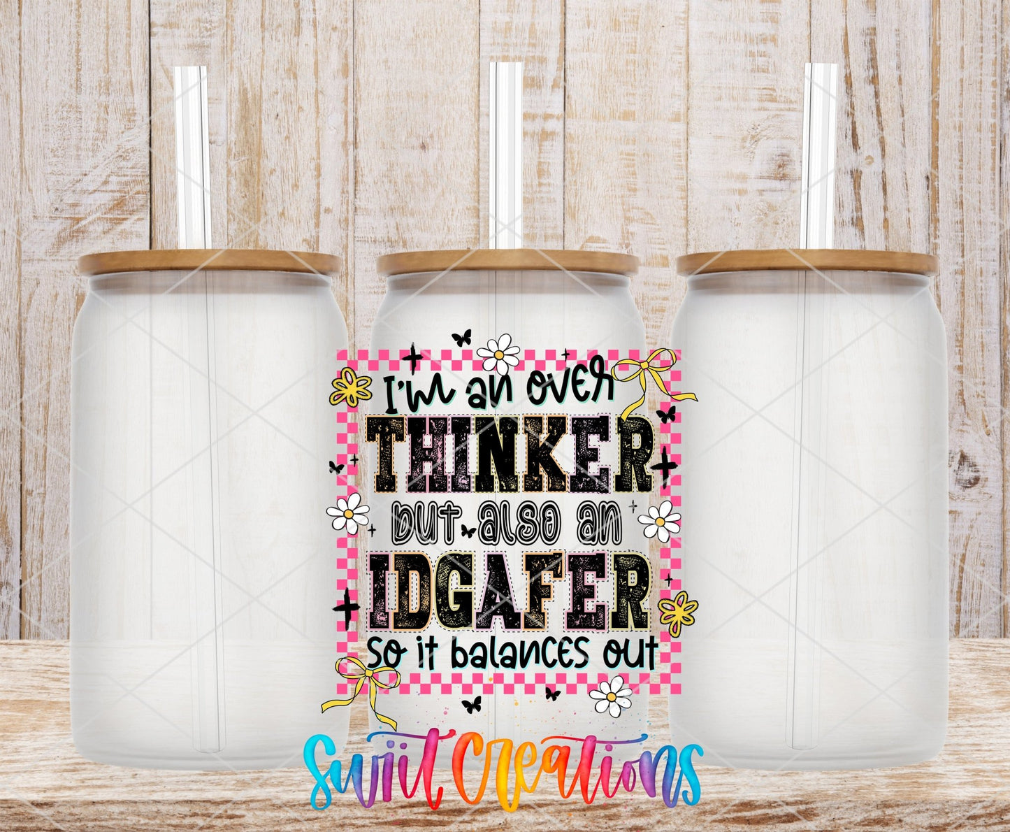 I’m An Over Thinker But Also An IDGAFer UV DTF transfer applied to a clear glass can set from Swiit Creations