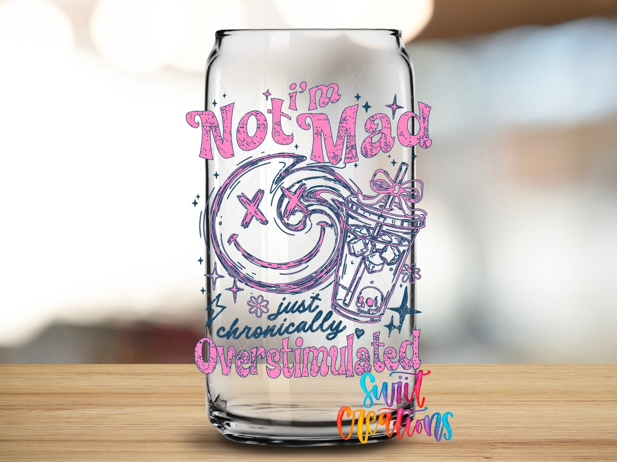 I’m Not Mad, Chronically Overstimulated UV DTF transfer applied to a clear glass can from Swiit Creations