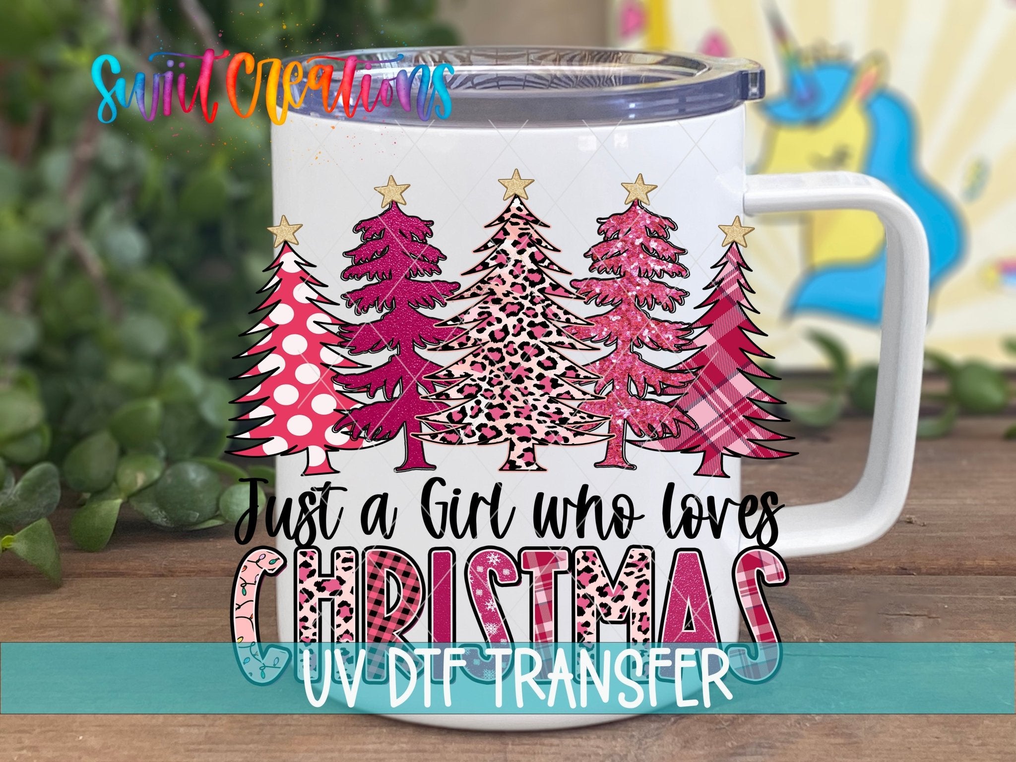 Just a Girl Who Loves Christmas UV DTF transfer displayed on a white coffee mug from Swiit Creations
