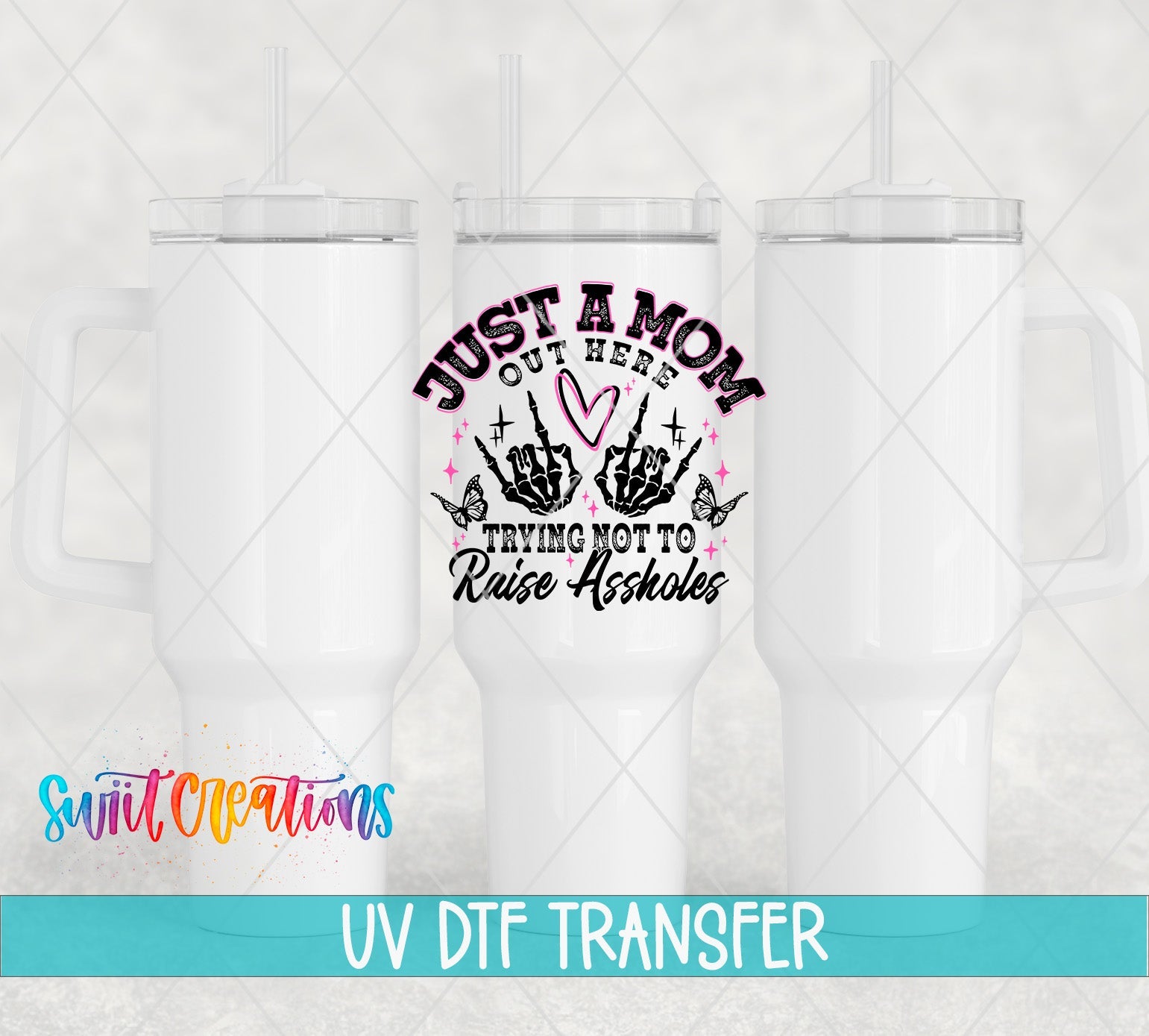 Just a Mom Trying Not To Raise Assholes UV DTF transfer applied to a white tumbler set from Swiit Creations