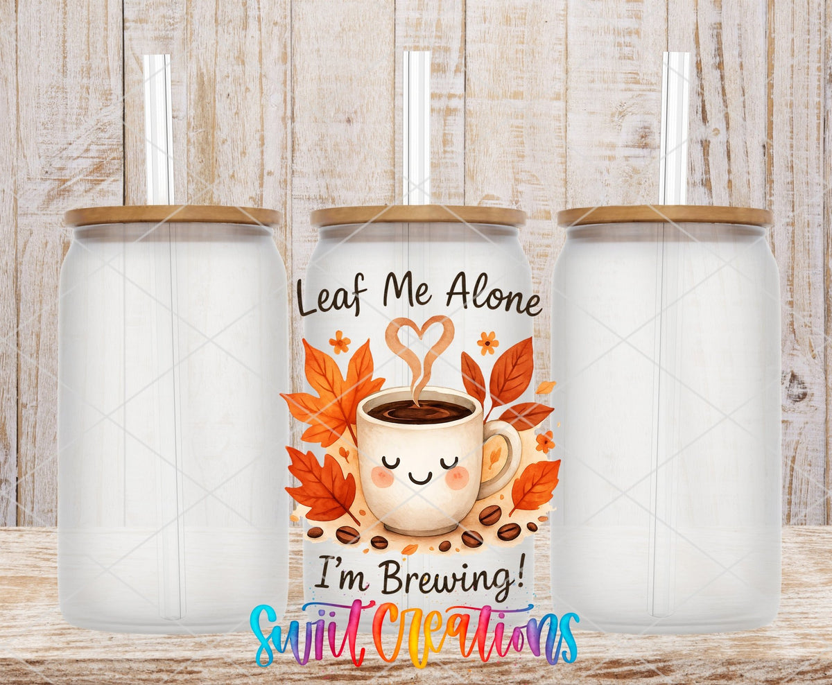 Leaf Me Alone Fall Coffee UV DTF transfer applied to a clear glass can set from Swiit Creations