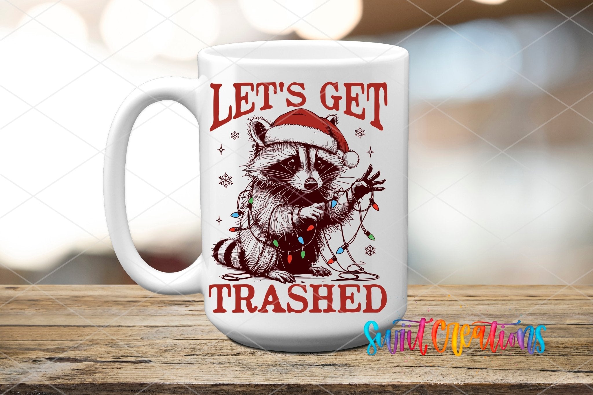 Swiit Creations UV DTF Let’s Get Trashed Christmas Raccoon transfer applied to a white ceramic mug