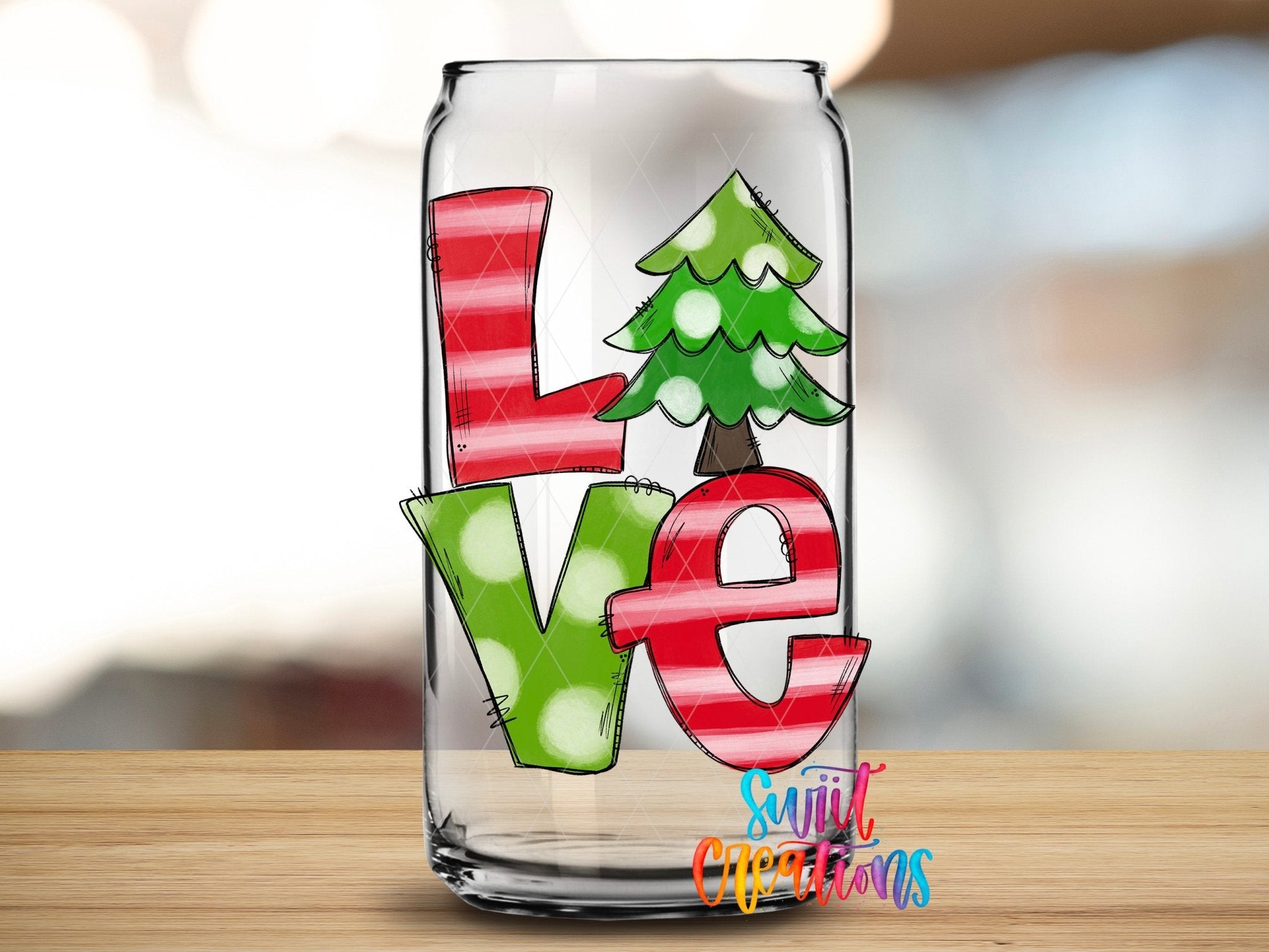 Swiit Creations Love Christmas Tree holiday UV DTF transfer shown on a clear glass can