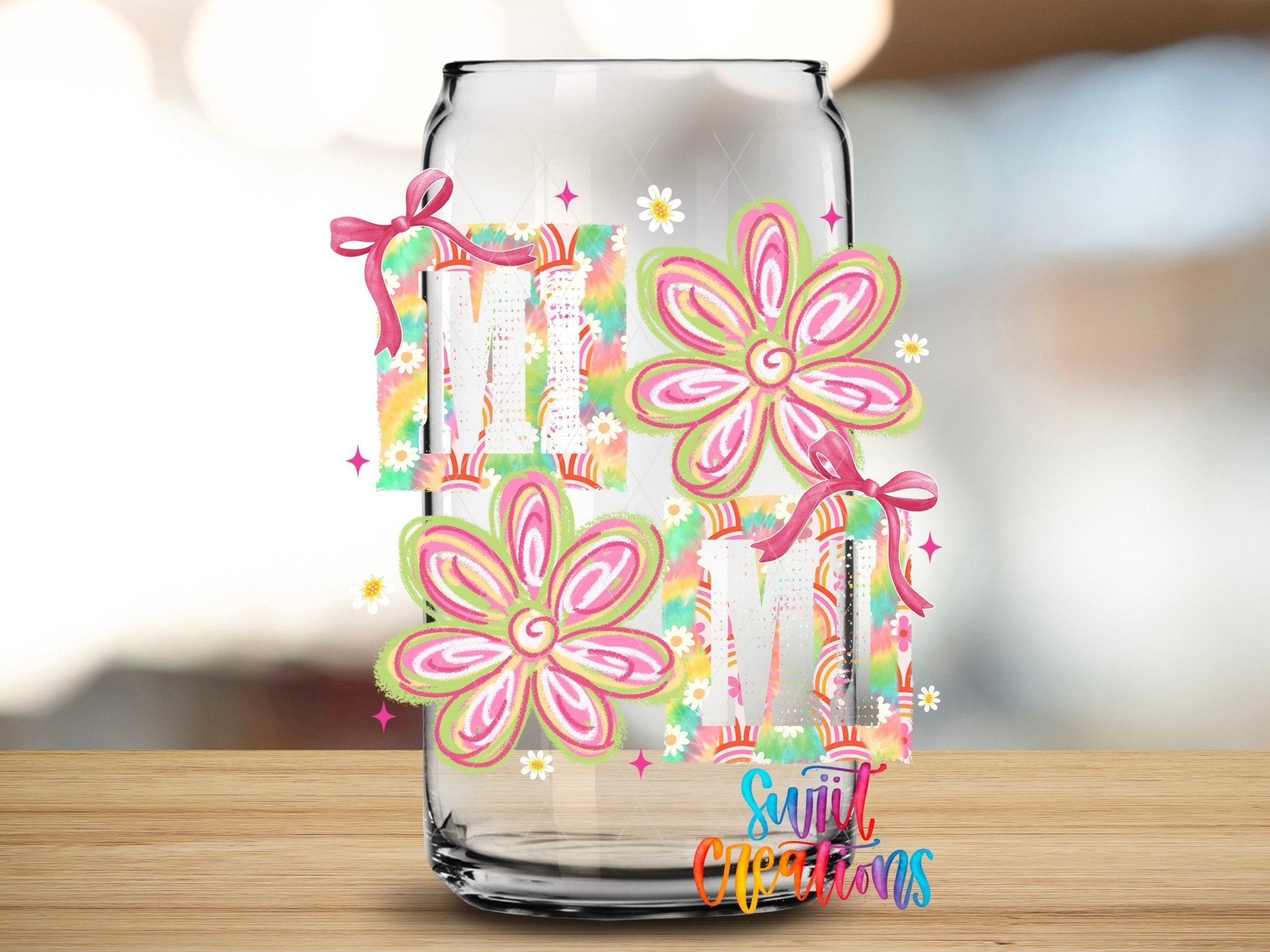 Mimi Tie Dye Flowers UV DTF transfer applied to a clear glass can from Swiit Creations