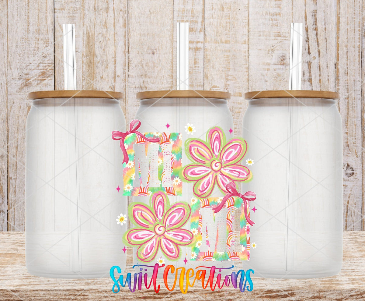 Mimi Tie Dye Flowers UV DTF transfer applied to a clear glass can set from Swiit Creations
