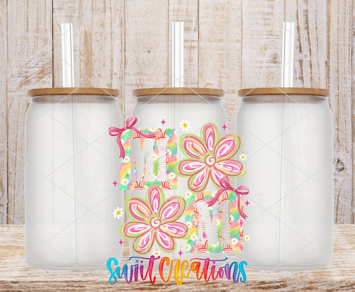 Mini Tie Dye Flowers UV DTF transfer applied to a clear glass can set from Swiit Creations