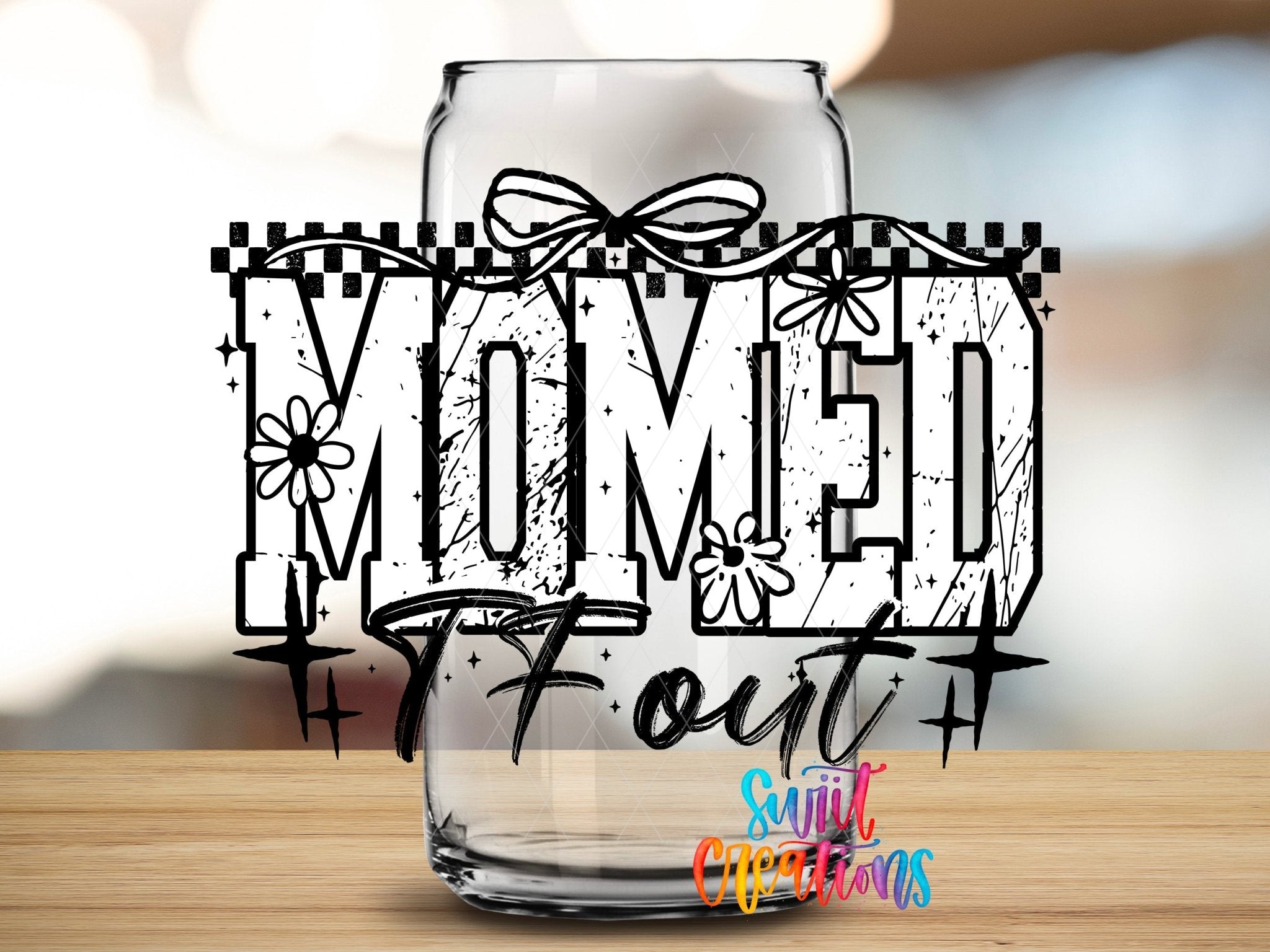 Momed The Fuck Out UV DTF transfer applied to a clear glass can from Swiit Creations