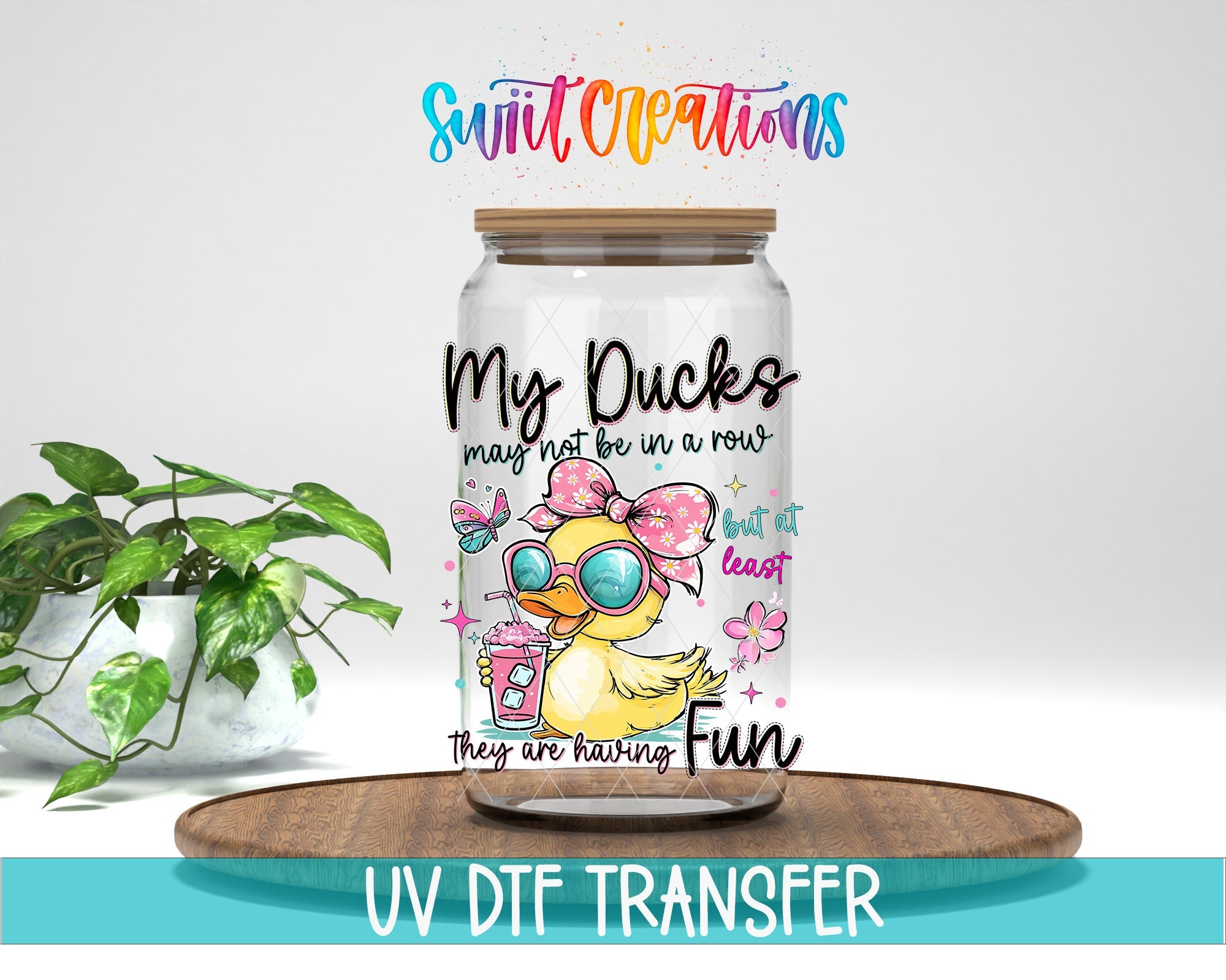 My Ducks May Not Be In A Row UV DTF transfer displayed on a clear jar mockup from Swiit Creations