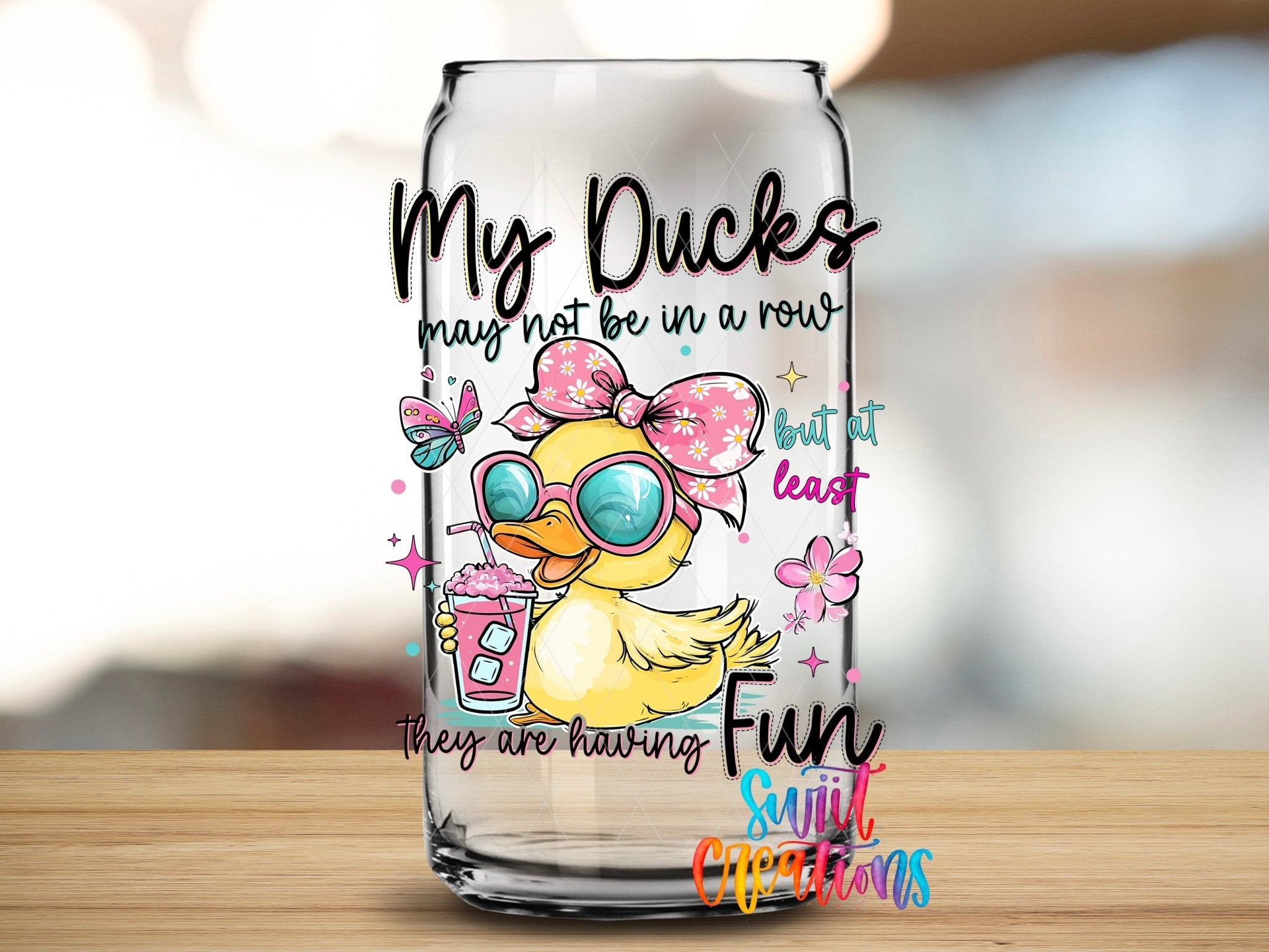 My Ducks May Not Be In A Row UV DTF transfer applied to a clear glass can from Swiit Creations