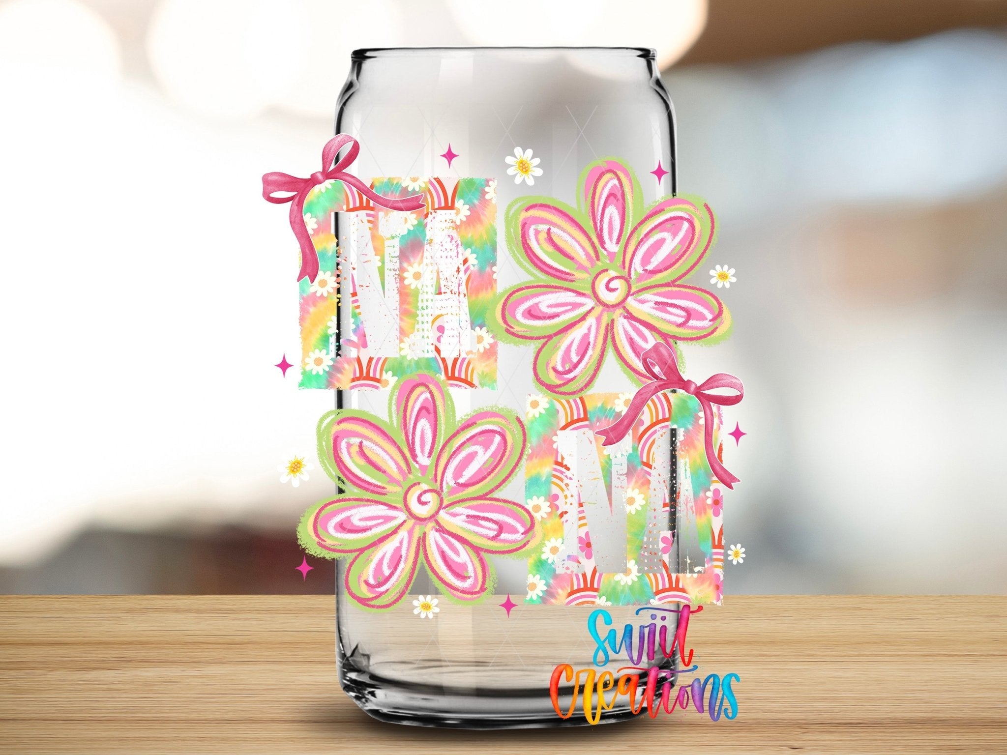 Nana Boho Rainbow Floral UV DTF transfer applied to a clear glass can from Swiit Creations