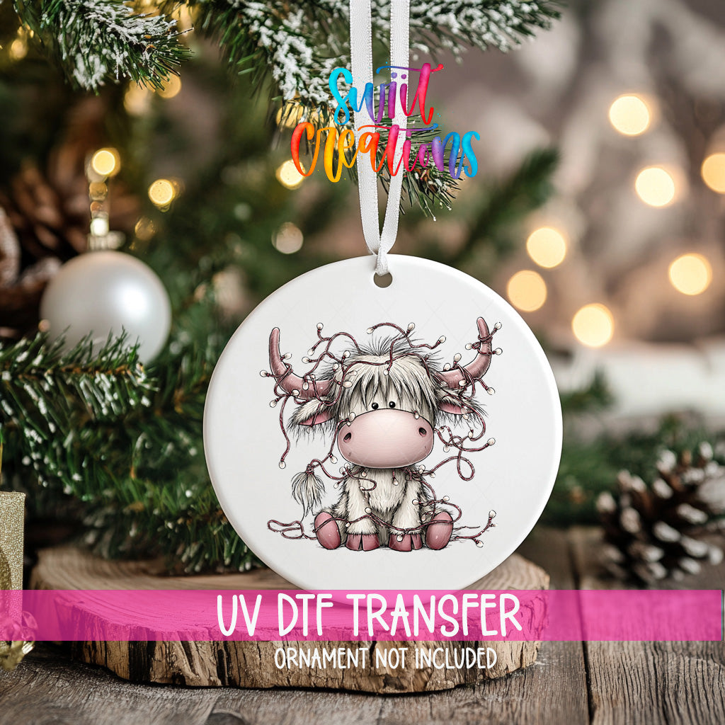 Highland cow Christmas lights UV DTF transfer on a round ornament mockup