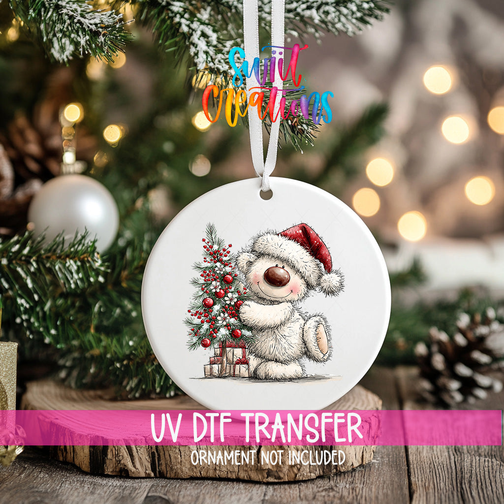 White Christmas bear ornament UV DTF transfer hugging a red berry decorated tree, mockup view 2