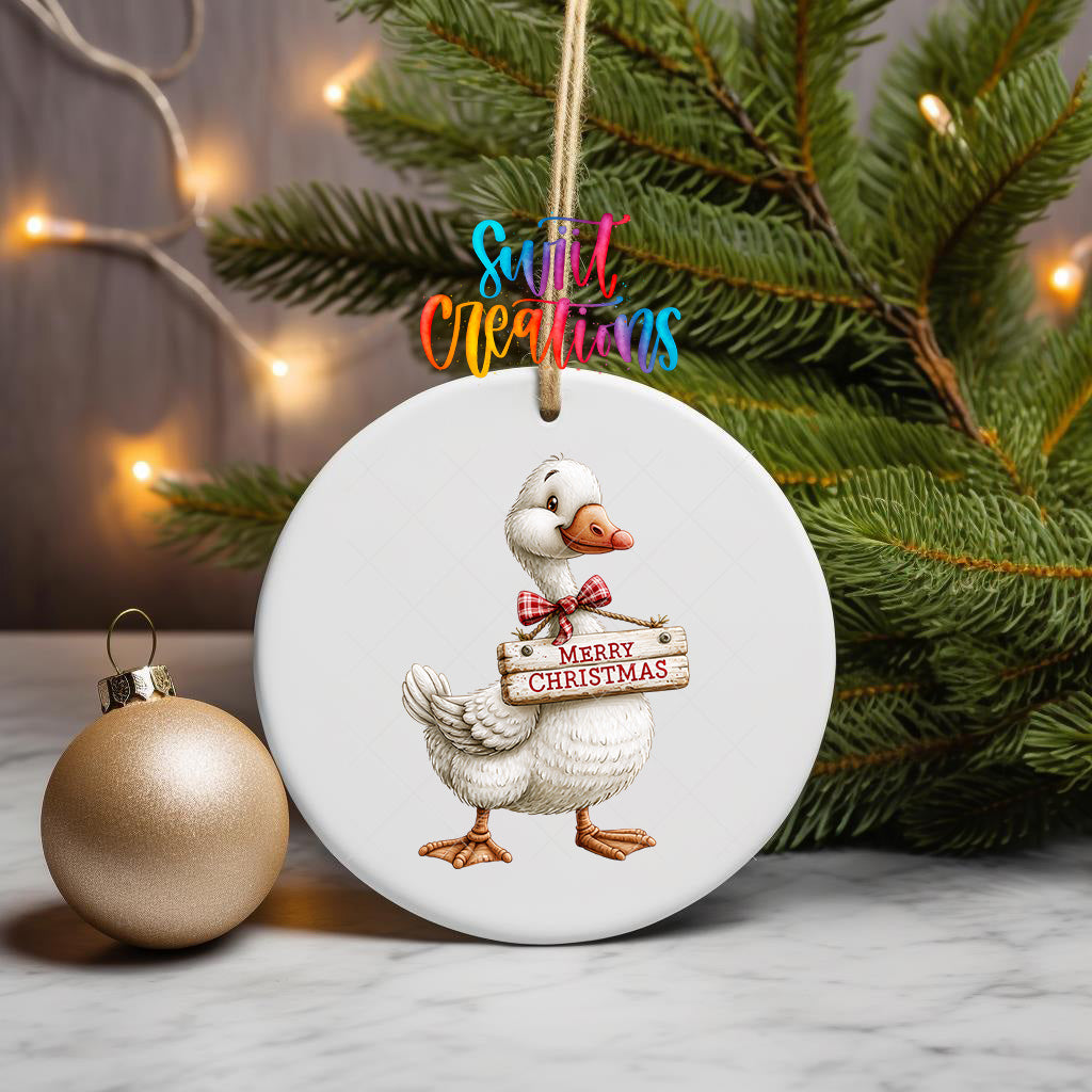 Christmas goose ornament UV DTF transfer with red plaid bow and Merry Christmas sign, mockup view 3