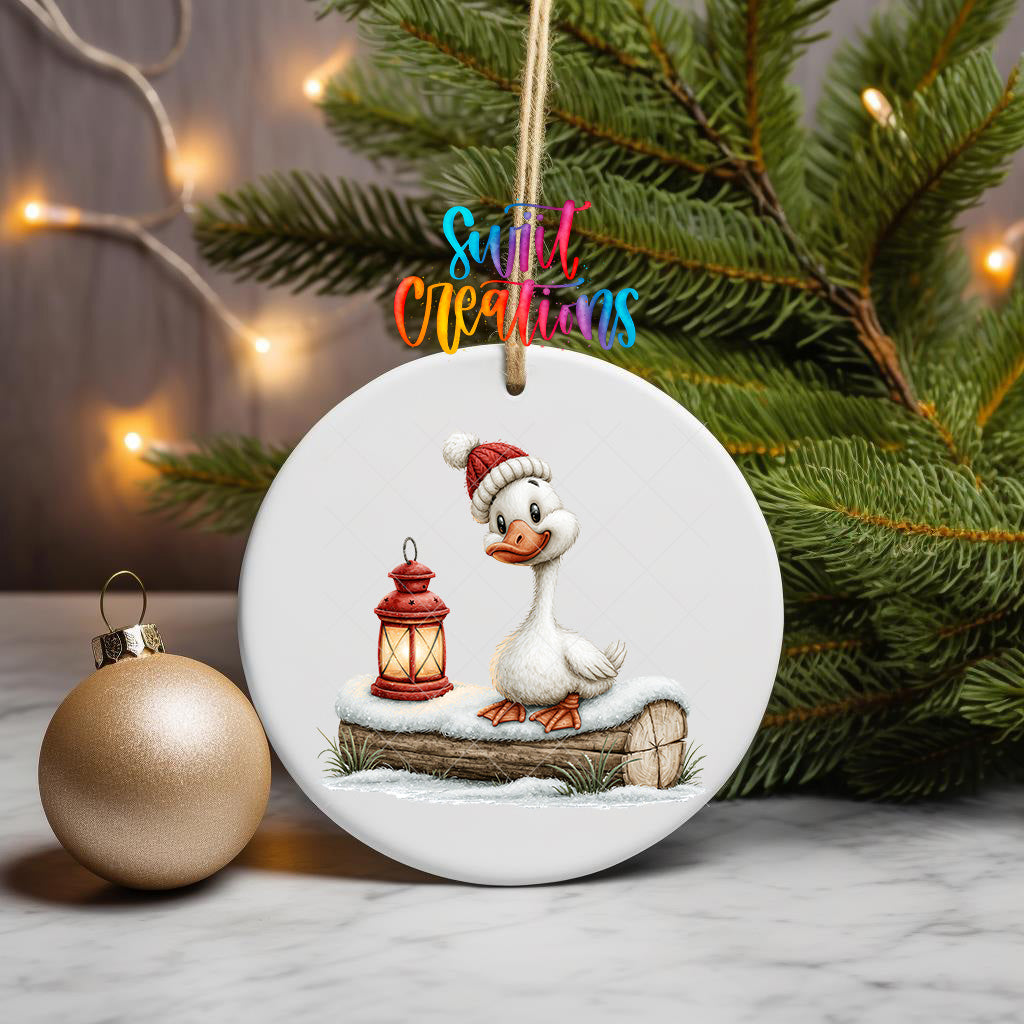 Christmas goose ornament UV DTF transfer in knit hat beside glowing red lantern, mockup view 3