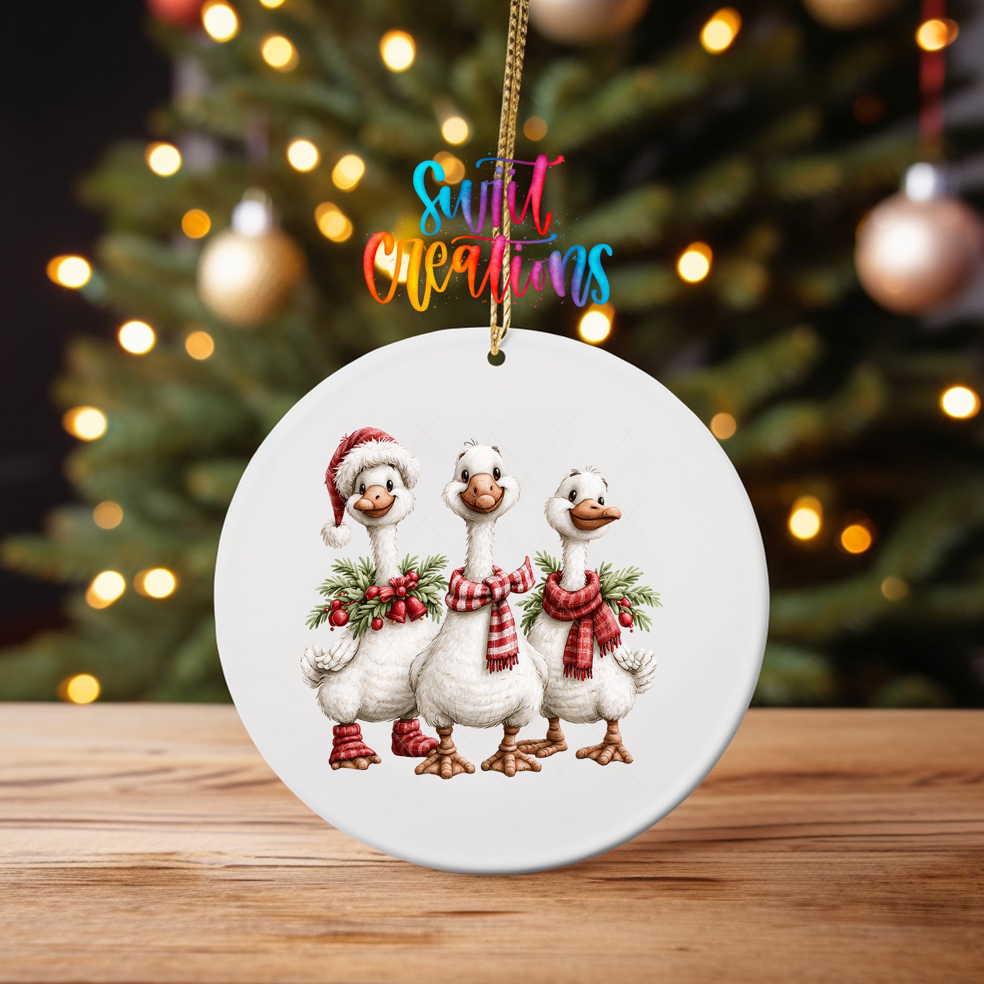 Three Christmas geese ornament UV DTF transfer with red plaid scarves, greenery, and berries, mockup view 4