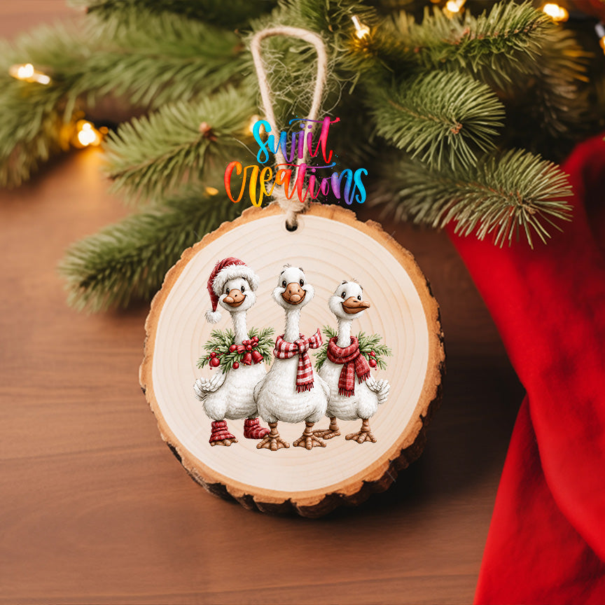 Three Christmas geese ornament UV DTF transfer with red plaid scarves, greenery, and berries, mockup view 6