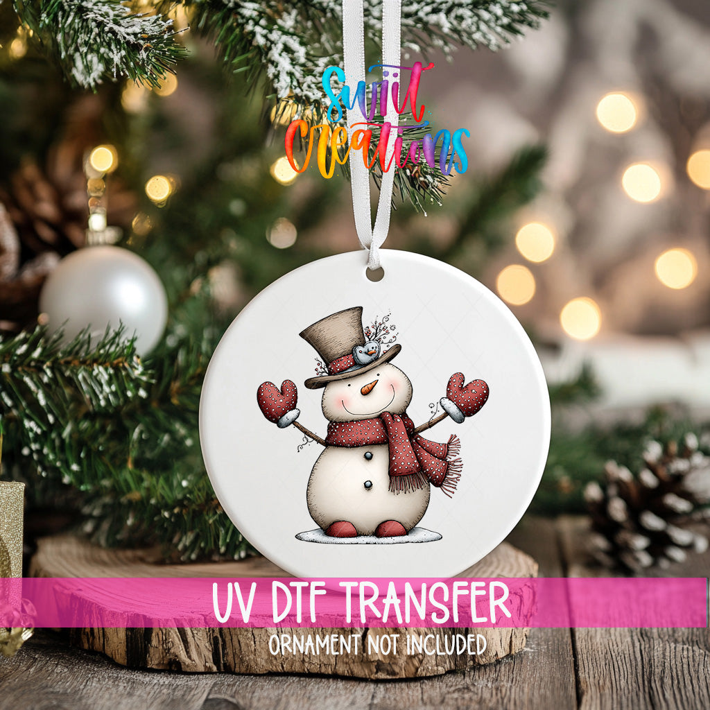 Whimsical snowman ornament UV DTF transfer with tall top hat, red scarf, and dotted mittens, mockup view 2