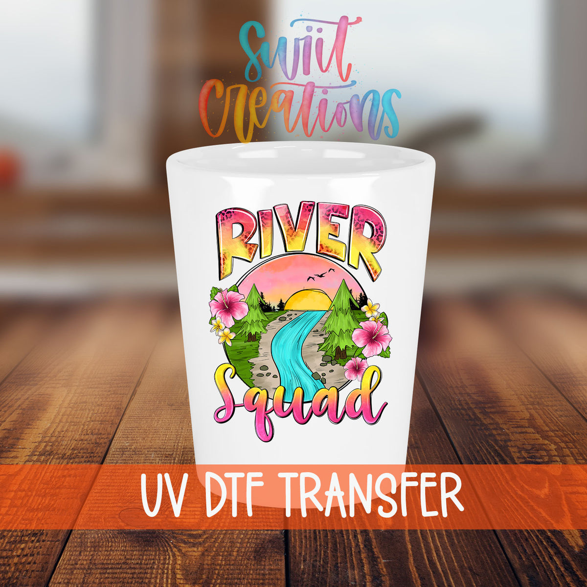 River Squad shot glass transfer on a white shot glass on a wooden table