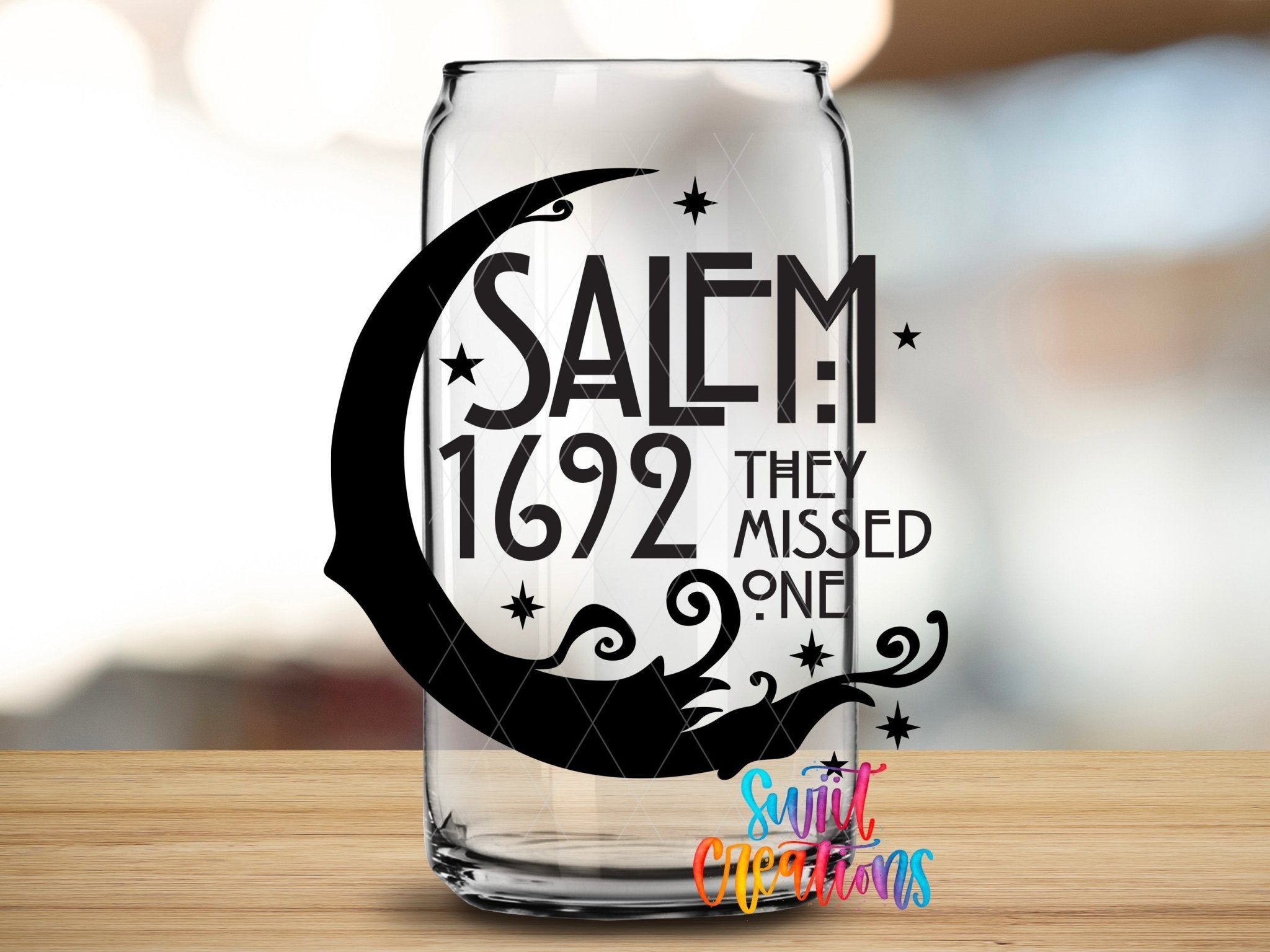 Salem 1692 They Missed One UV DTF transfer applied to a clear glass can from Swiit Creations